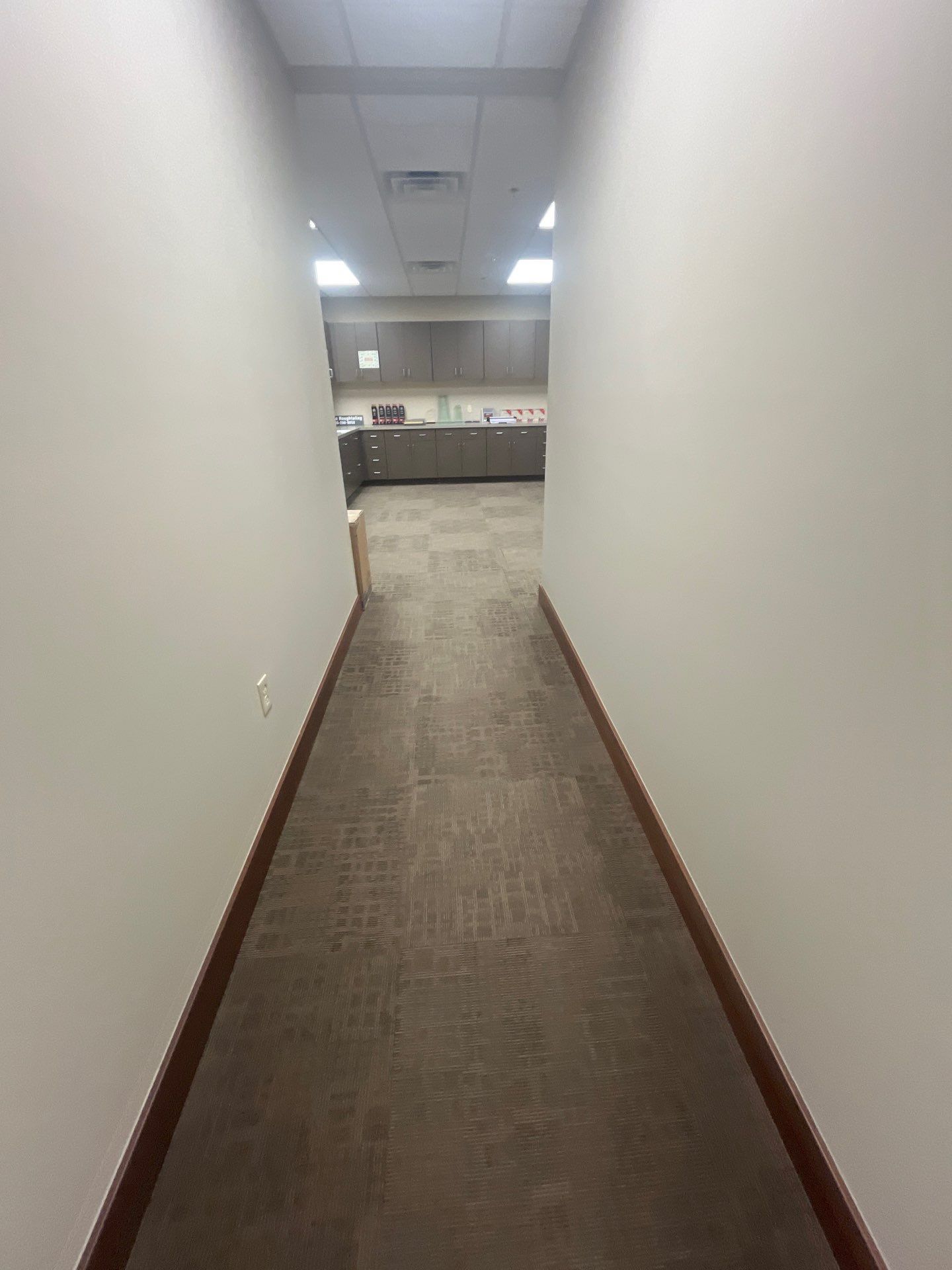 Commercial Office Interior Remodel and Modern Suite Refresh in Sioux Falls by Select Painting, Coatings & Garage Cabinets