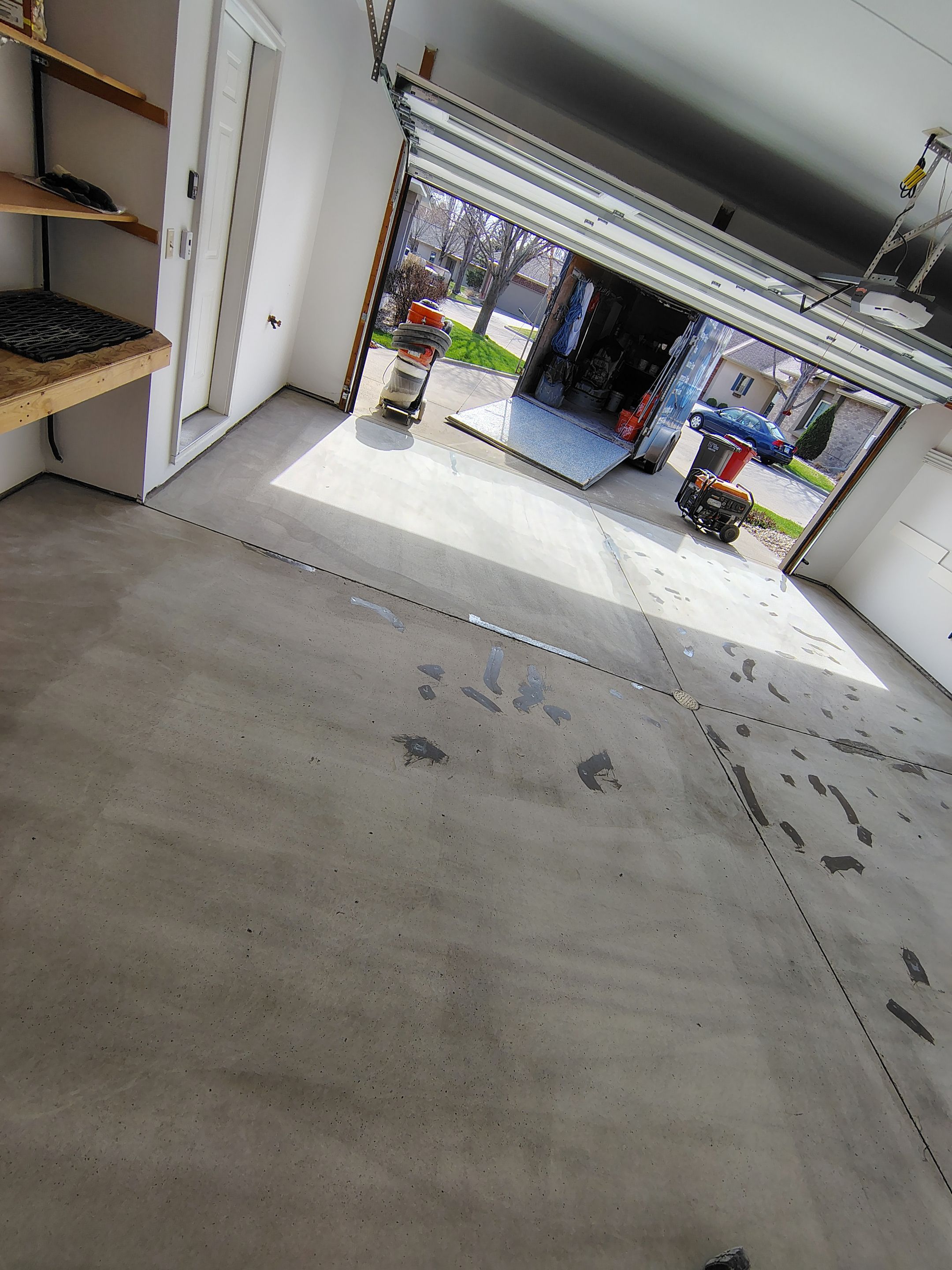 Grey Speckled Epoxy Garage Floor Coating in Sioux Falls by Select Painting, Coatings & Garage Cabinets