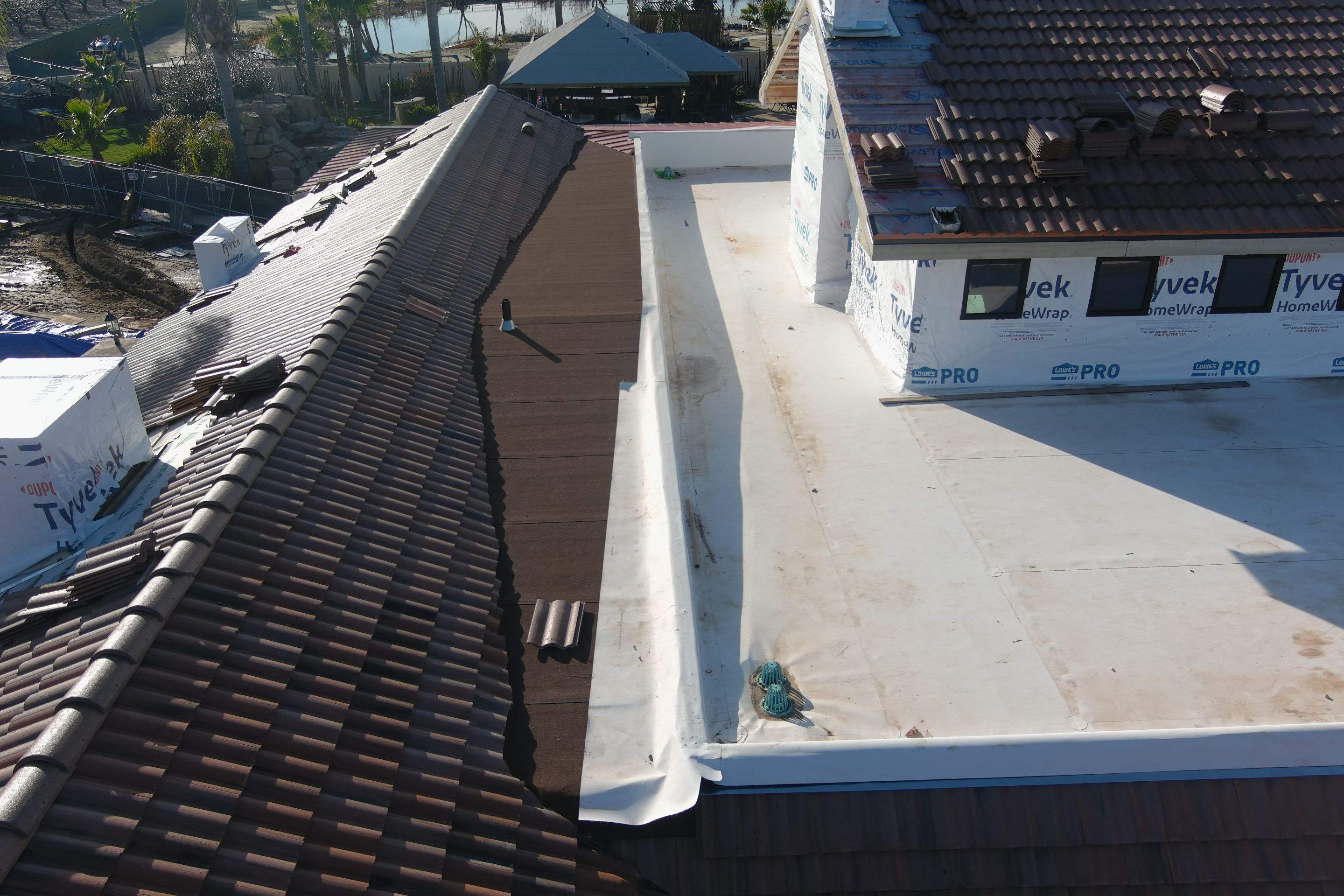 Tile, Metal, and TPO roofing project (new construction) by Straight Edge Roofing Inc