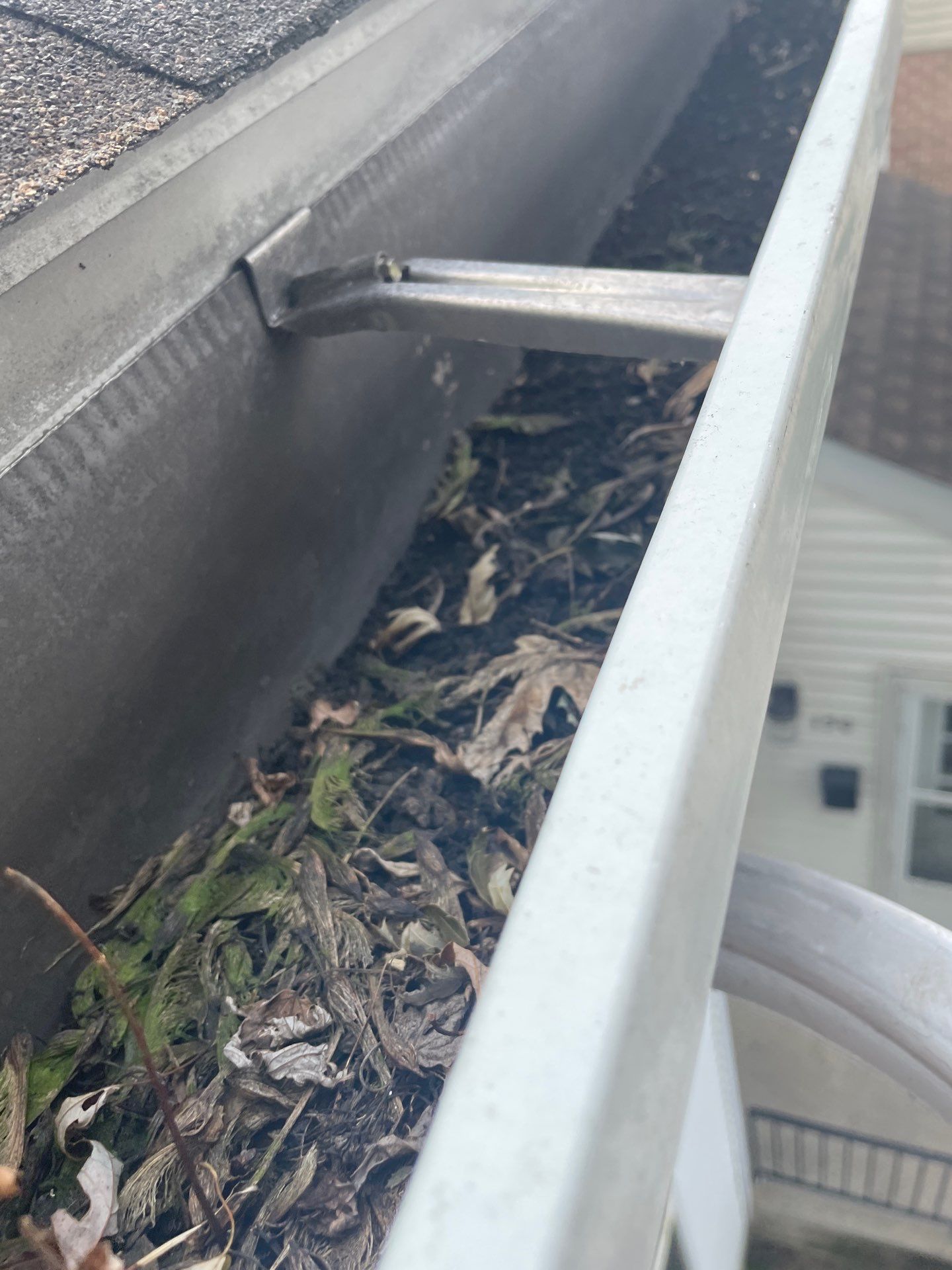 Commercial gutter cleaning Harrisburg, PA before photo with filled gutters