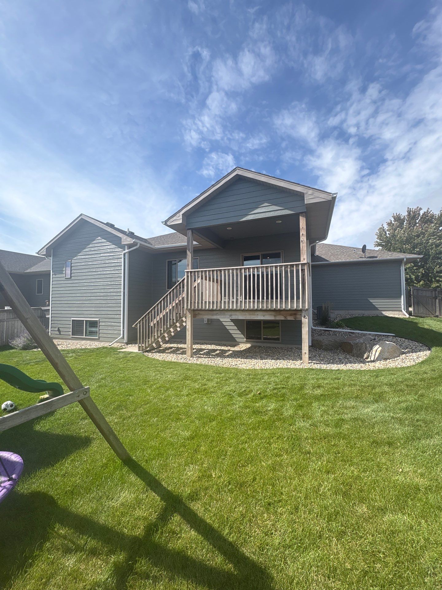 Full Exterior Home Painting on Blue Lap Siding in Sioux Falls by Select Painting, Coatings & Garage Cabinets