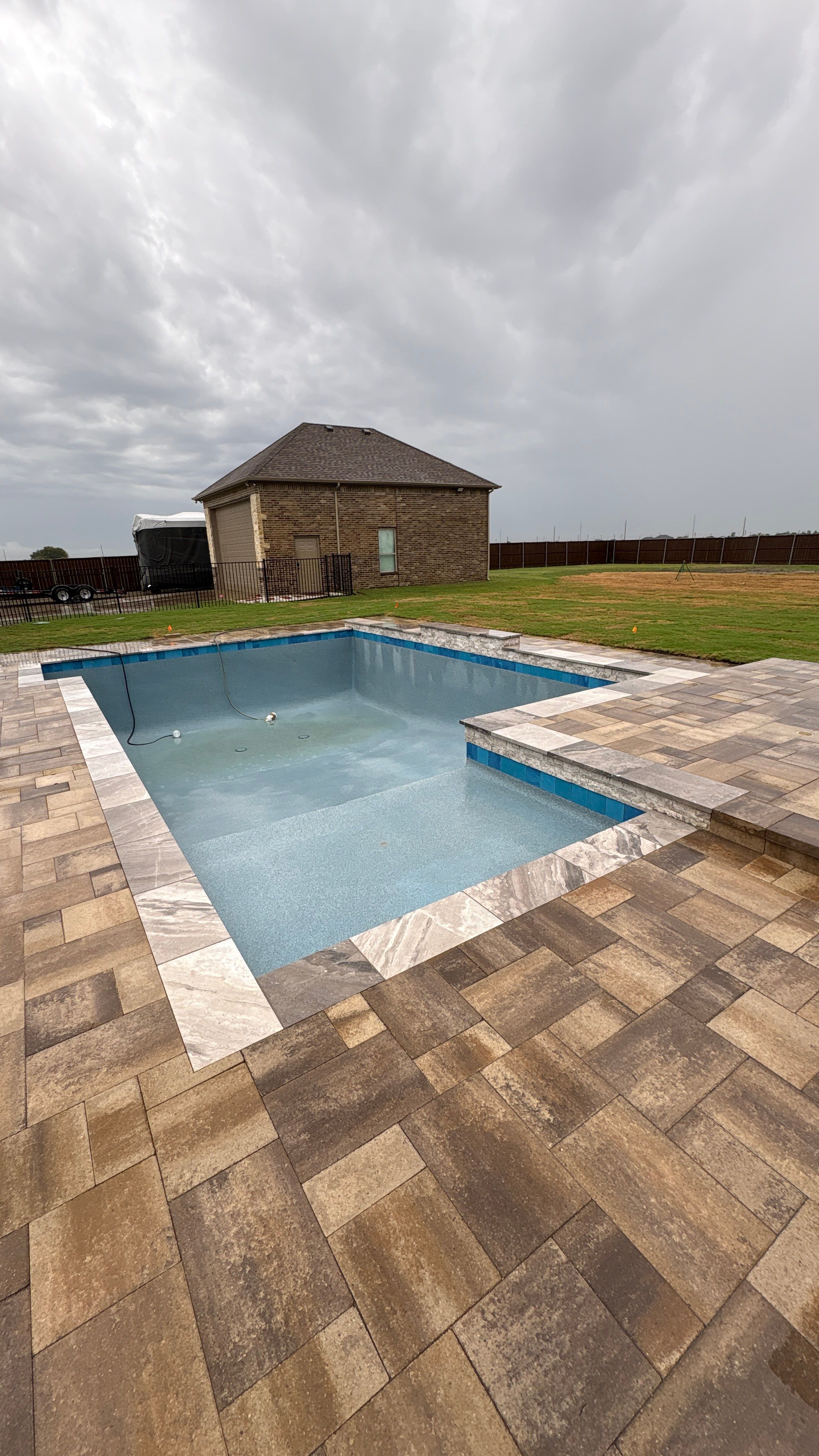 Modern Geometric Pool with Tanning Ledge by Pinnacle Pools and Spas - DFW