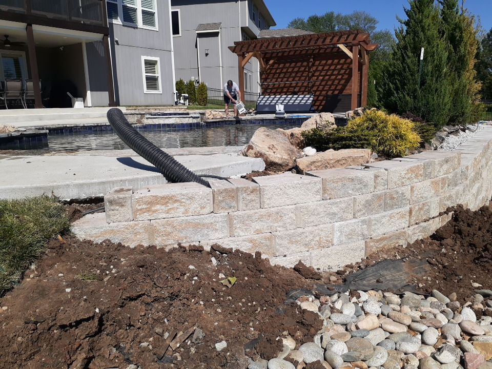 Pool Retaining Wall by LAND ESCAPES LLC
