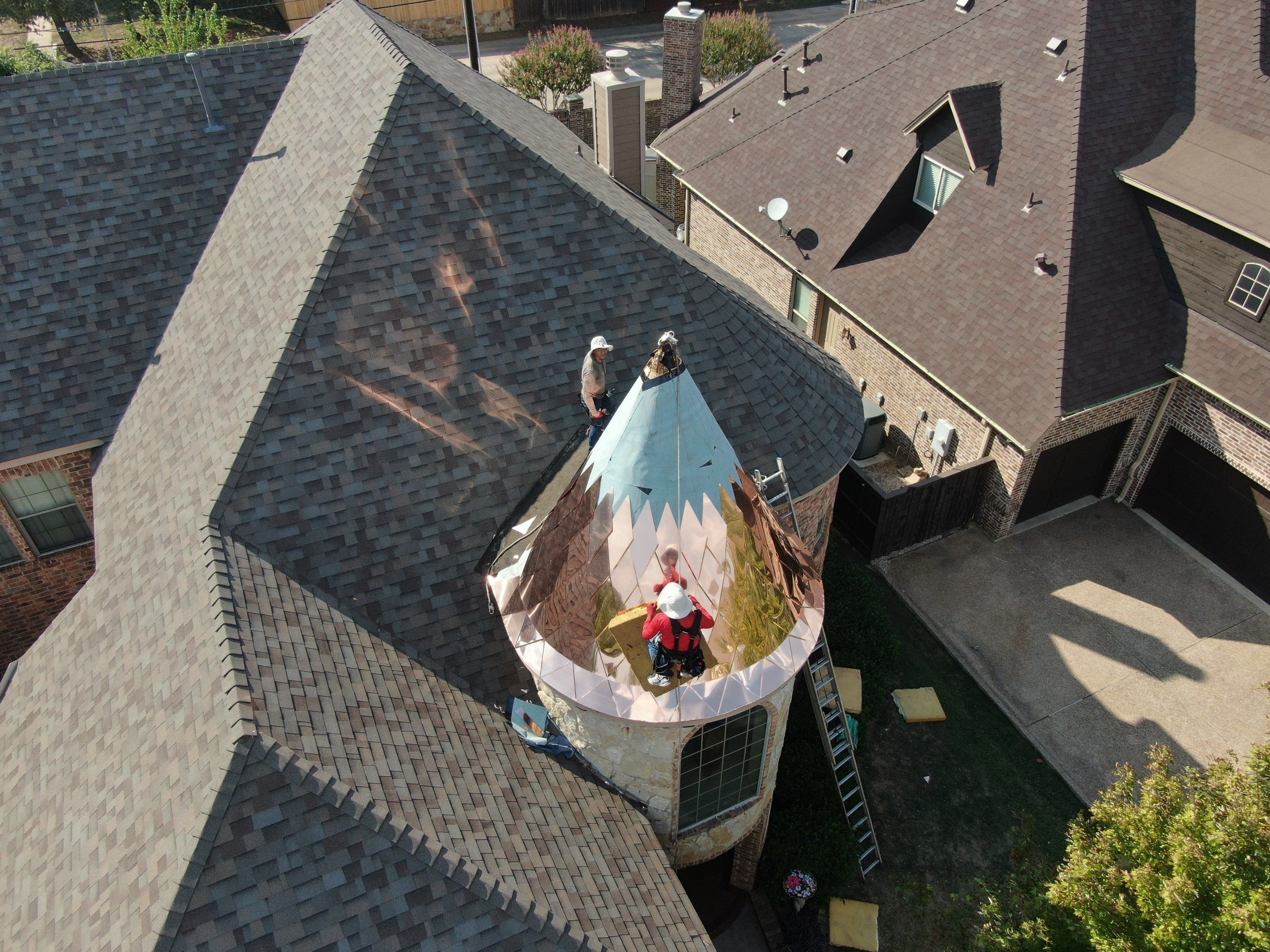 Installing Custom copper turret and Malarkey Vista Class 4 shingles Hail Damage Upgrade by Becker Roofing and Exteriors