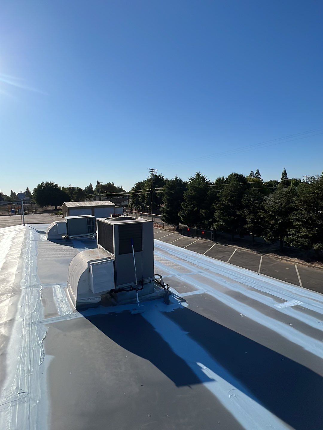 MR Roofing system using Benchmark/PUMA XL coatings over TPO single-ply roofing by Straight Edge Roofing Inc