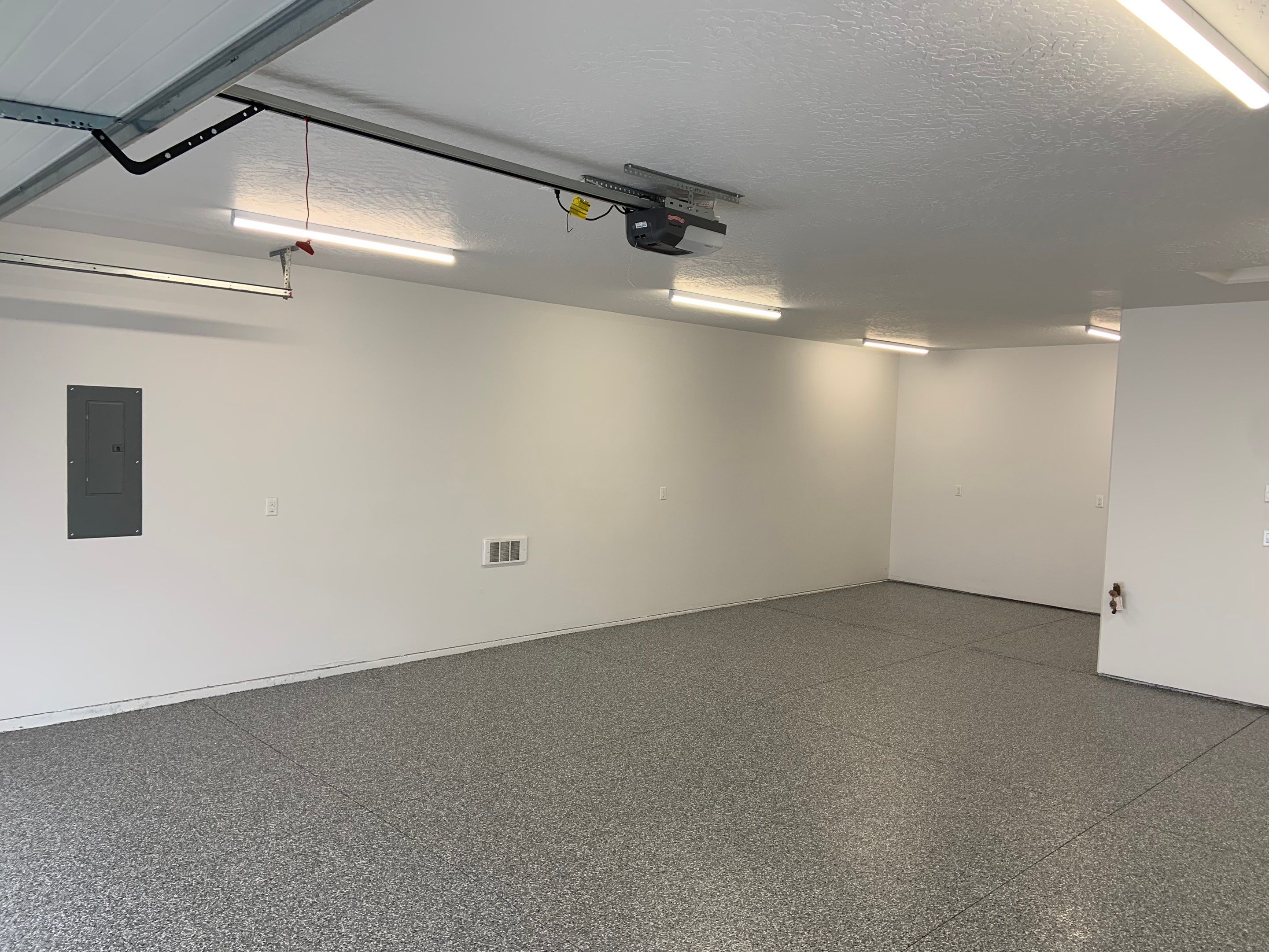 Garage Transformation using Smoke by Croc Coatings, LLC