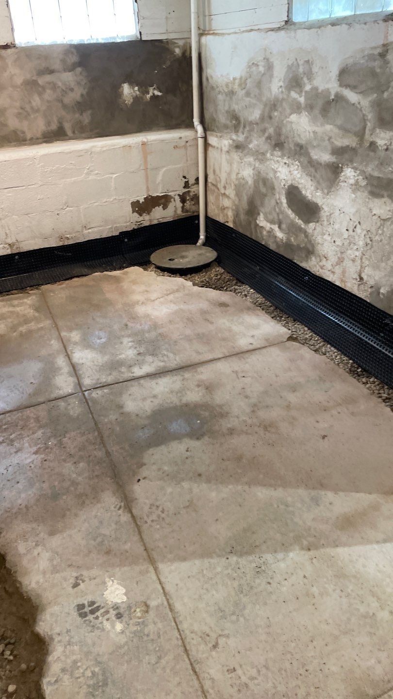 Drain Tile, Window Wells & Buried Discharge in Minneapolis by Waterproofing Northeast
