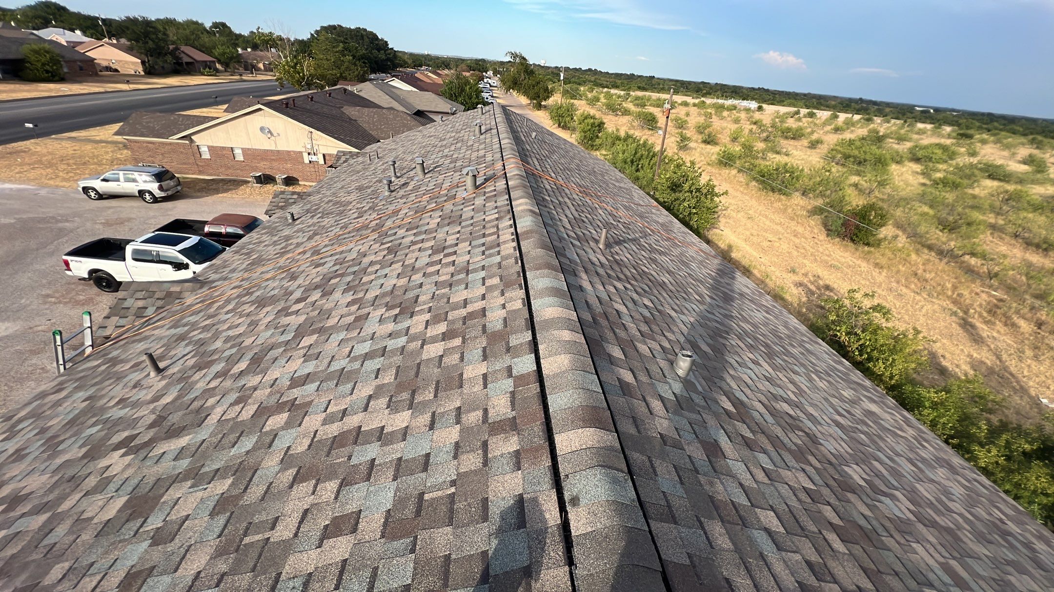 Commercial Roofing Installation using ATLAS Pinnacle Pristine Shingles by Harvey Roofing & Construction