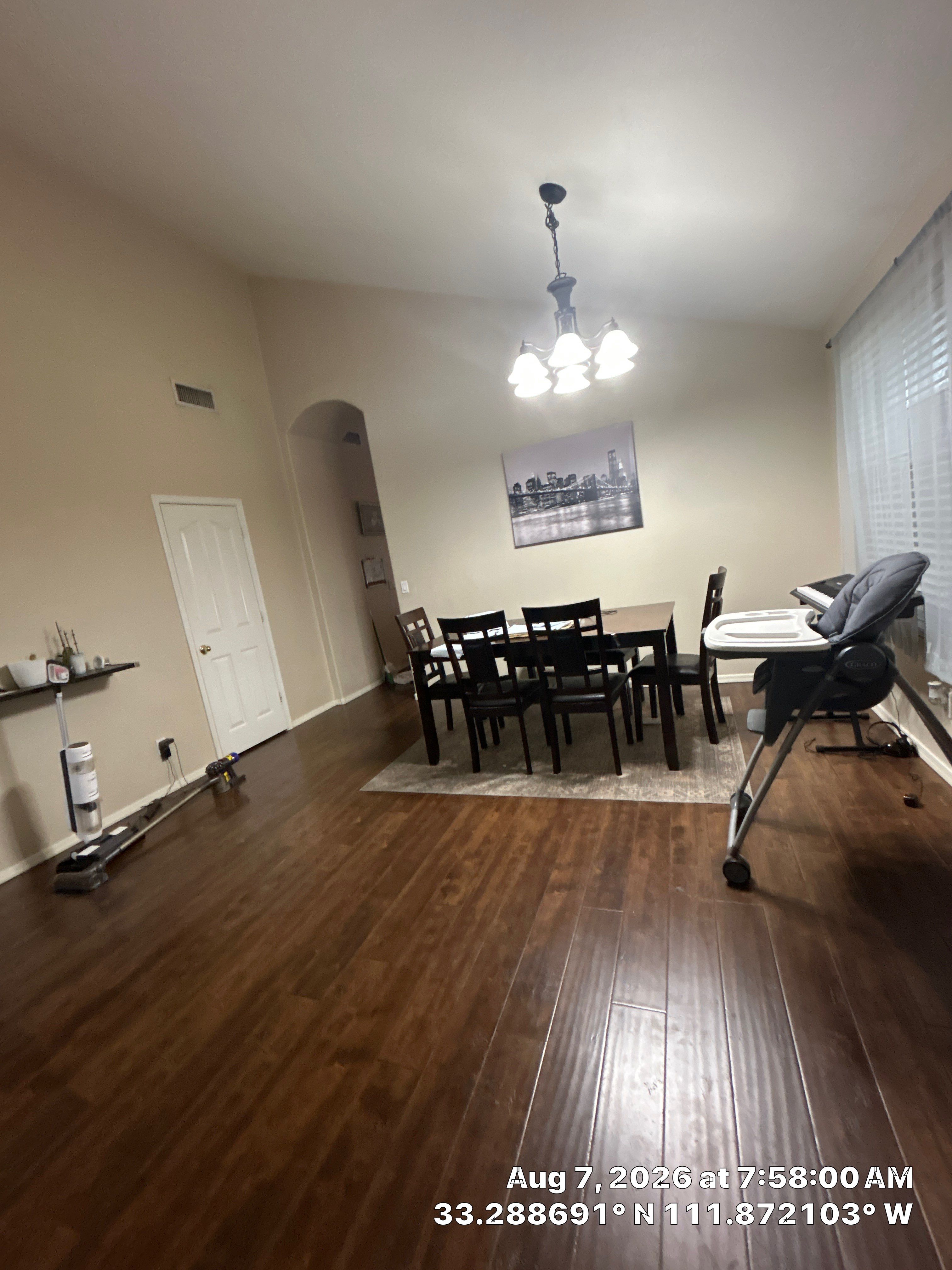 Modern Dining Room Renovation With Dark Wood Floors and Lighting by CompanyCam Sales Demo