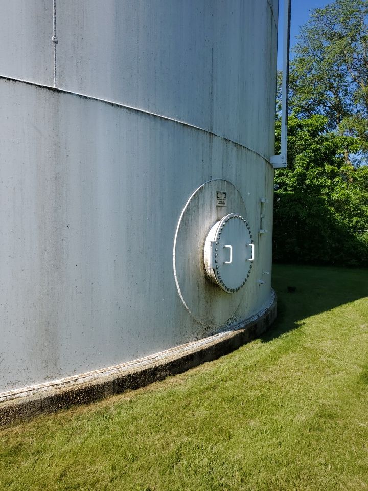 Water tank cleaning by Northern Power Washing LLC.