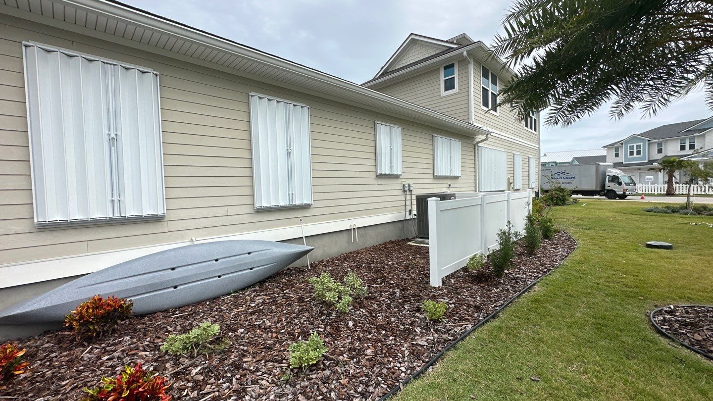 Hurricane Shutters using Accordions in White by Smart Guard Shutters