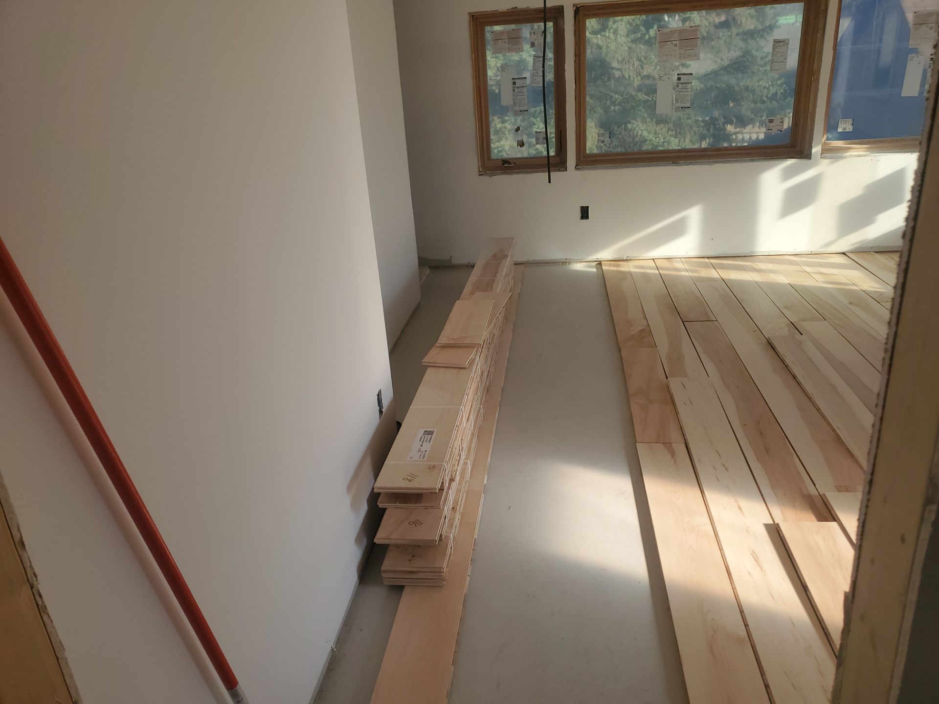 Full glue down Installation over radiant heat 7" Maple character grade by Ann Arbor Hardwoods 