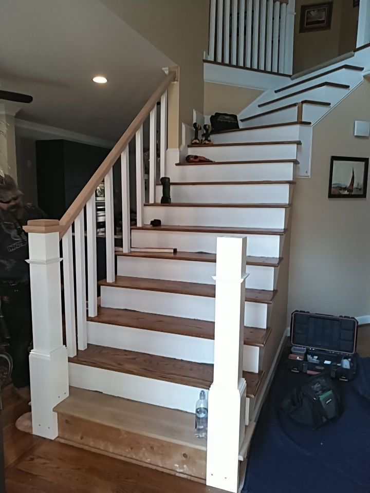 Stairway Installation using Red oak modern railings by House Custom Carpentry, LLC