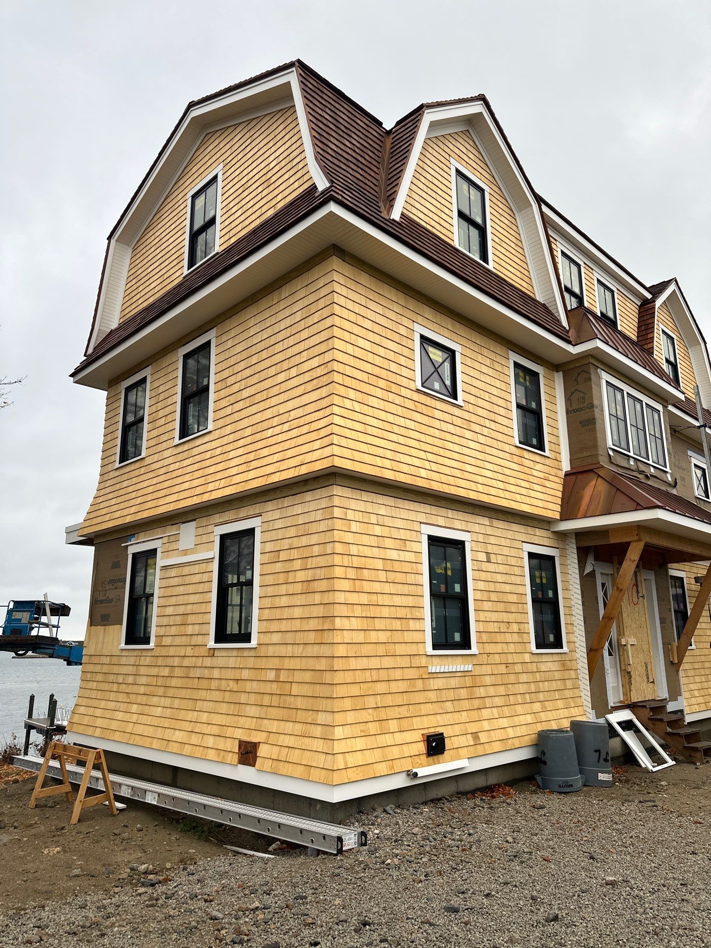 Great Island - Red Cedar Roofing, Yellow Cedar Siding, Standing Seam Copper, & Copper Gutters  by Rinaldi Brothers