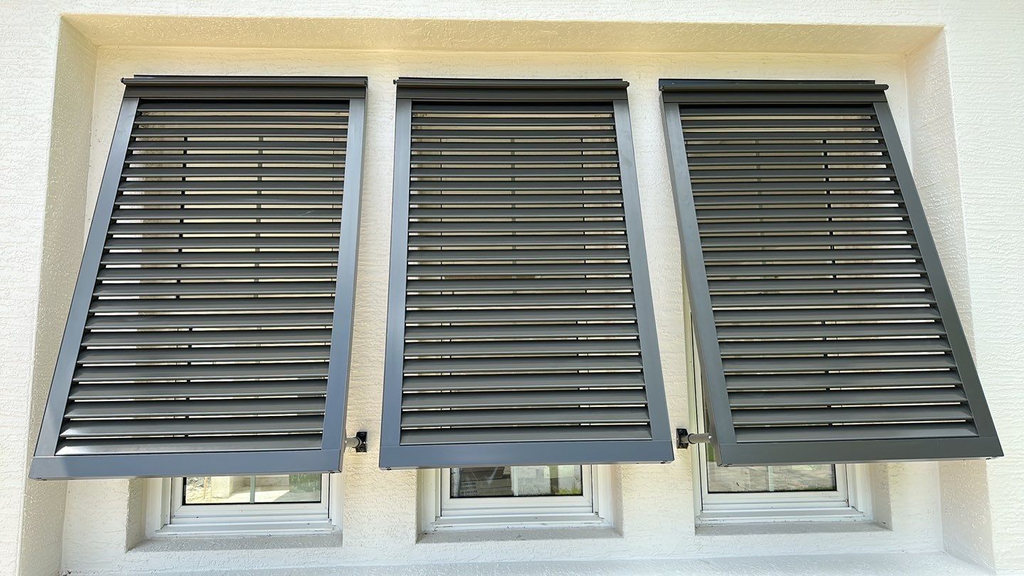 Bahama Shutters in Umbra Gray by Smart Guard Shutters