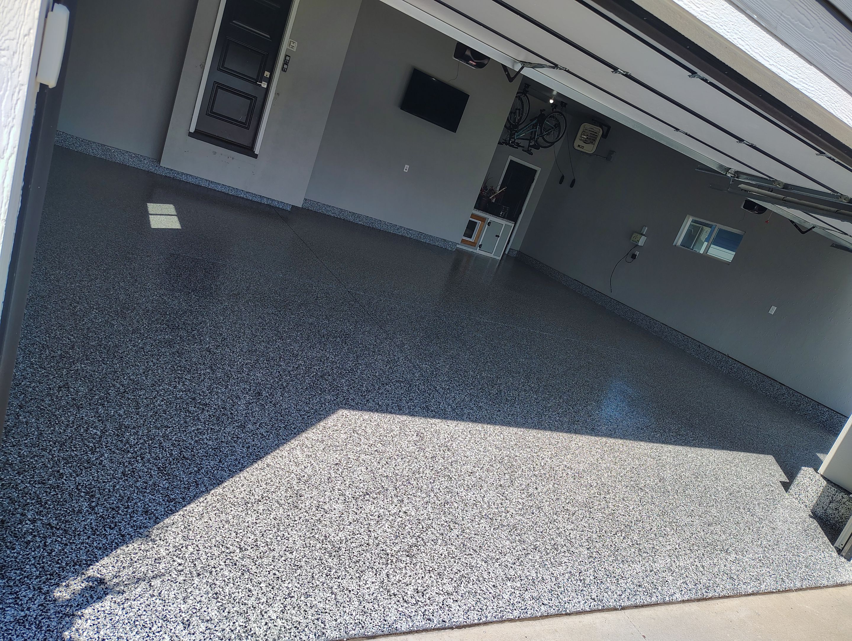 Custom Gray Flake Garage Floor Coating in Sioux Falls by Select Painting, Coatings & Garage Cabinets