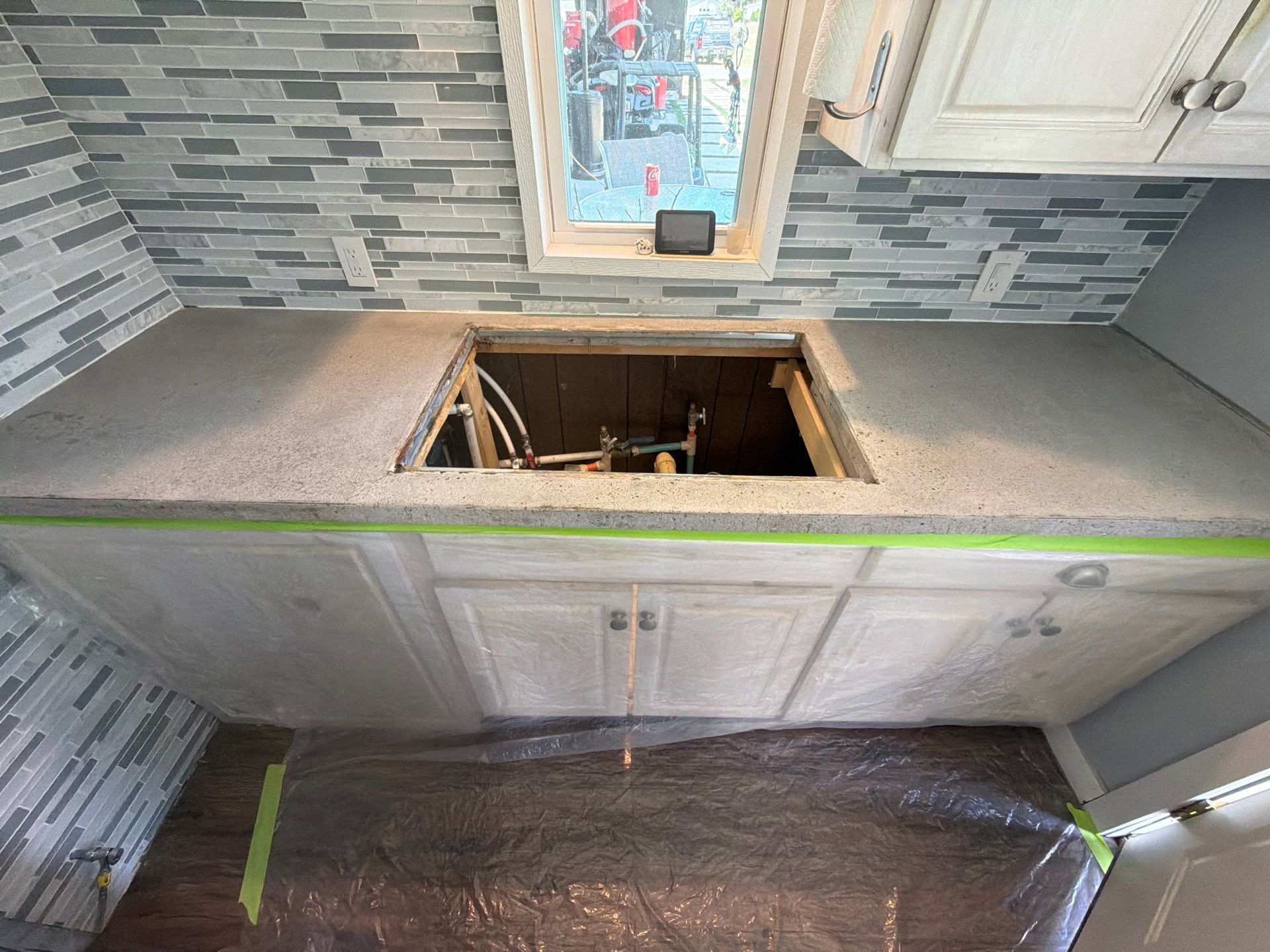 Custom Metallic Epoxy Floor and Polished Countertop Installation in Mears by Gordon Painting