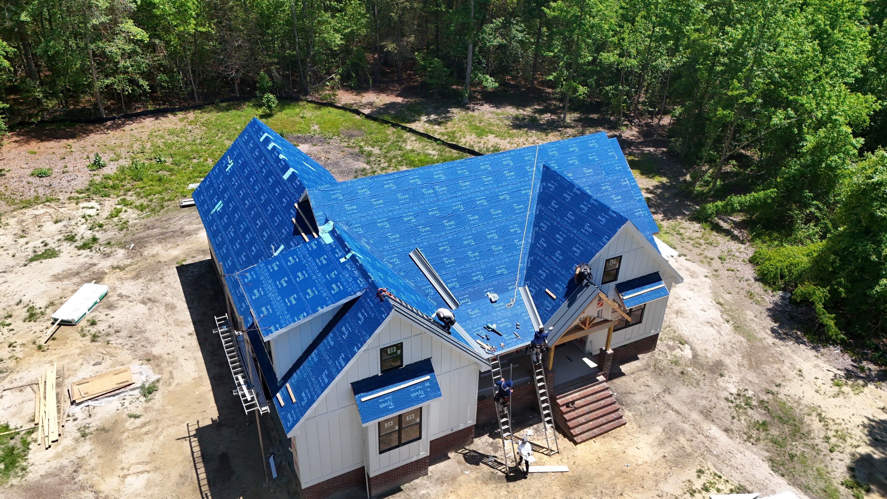 Custom New Construction Home Featuring Standing Seam Metal Roofing in Port Haywood by Cade Construction