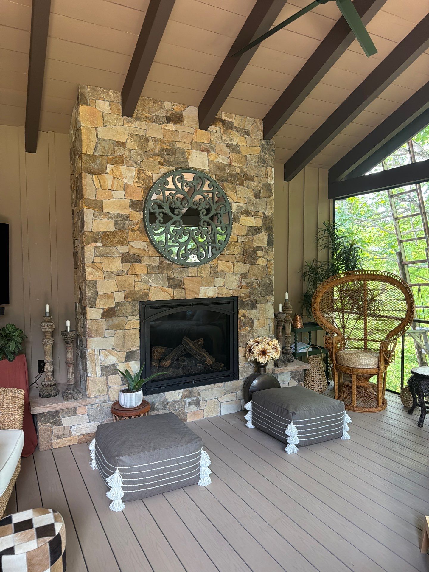 Custom Composite Deck with Stone Fireplace and Modern Cable Railing by Walnut Hollow Decks & Outdoor Living