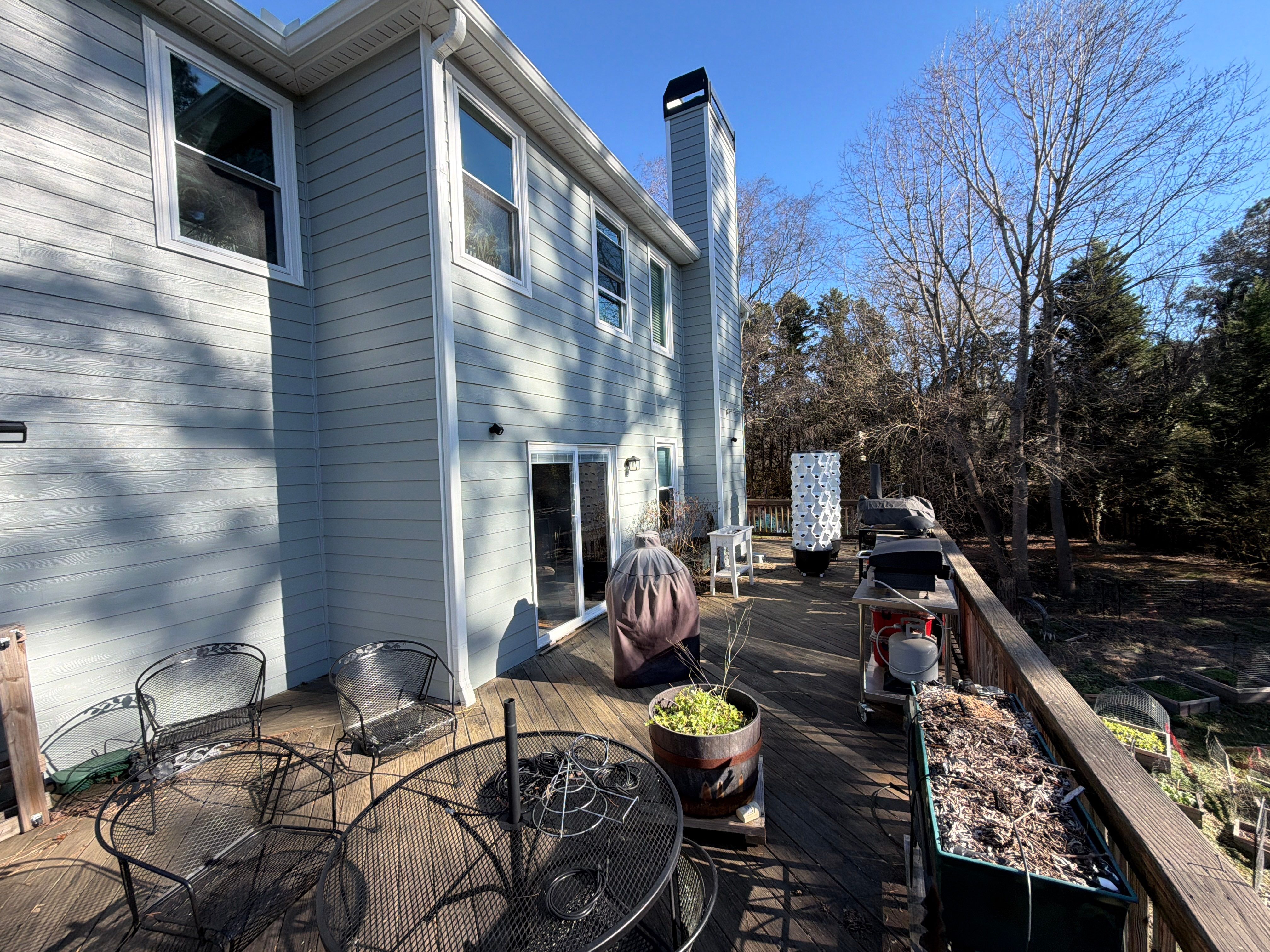 Covered Porch and Deck Build using Deckorators Venture Series Decking and Trex Select Aluminum Railing by Nelson Exteriors