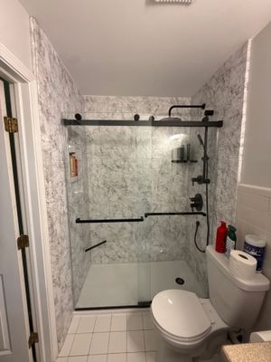 Tub-to-Shower Conversion in Traverse City Featuring Marble Pattern Wall Panels