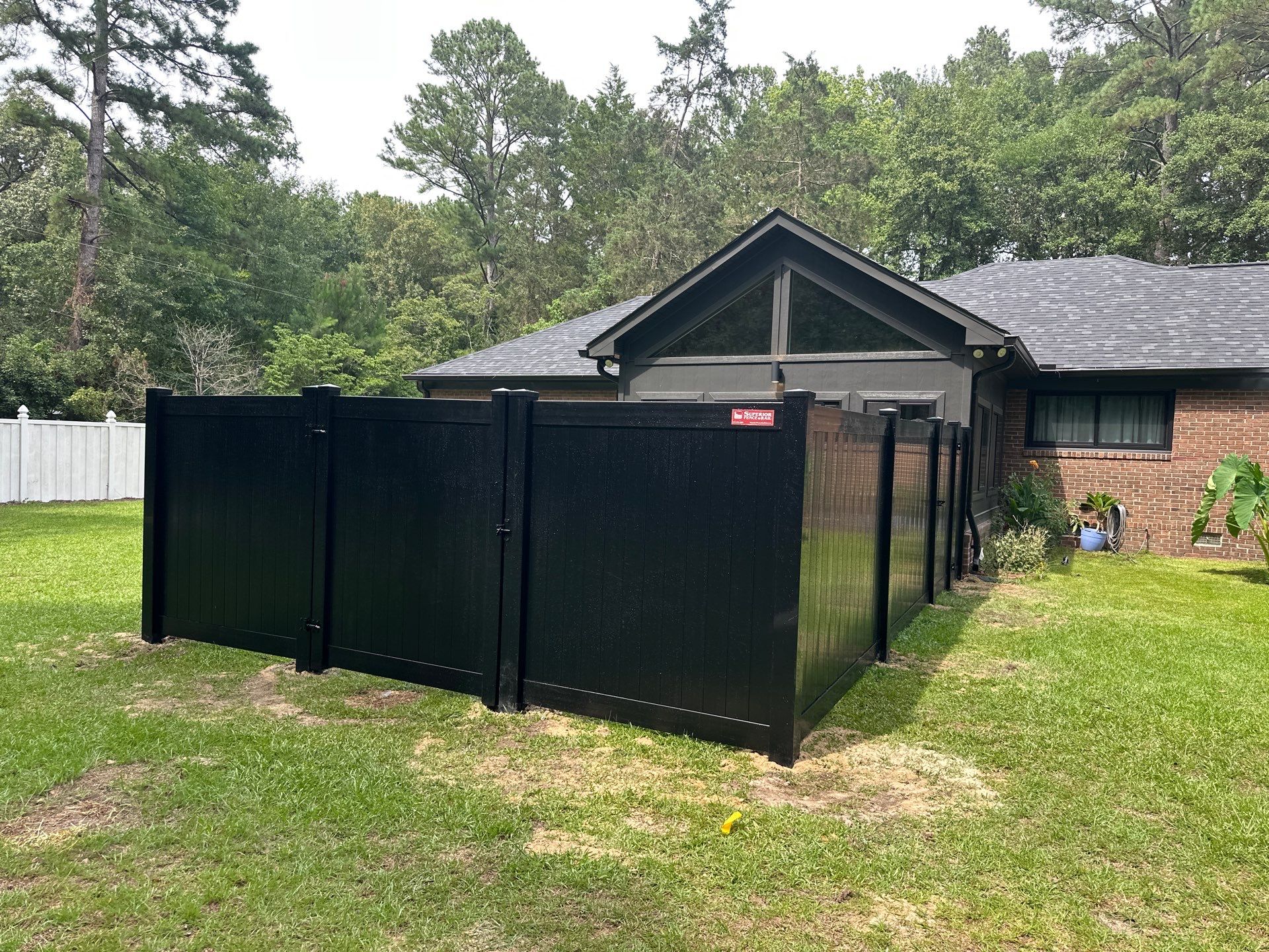 Black Vinyl Privacy Fence with Puppy Picket Aluminum Installation in Roseboro by Superior Fence and Rail