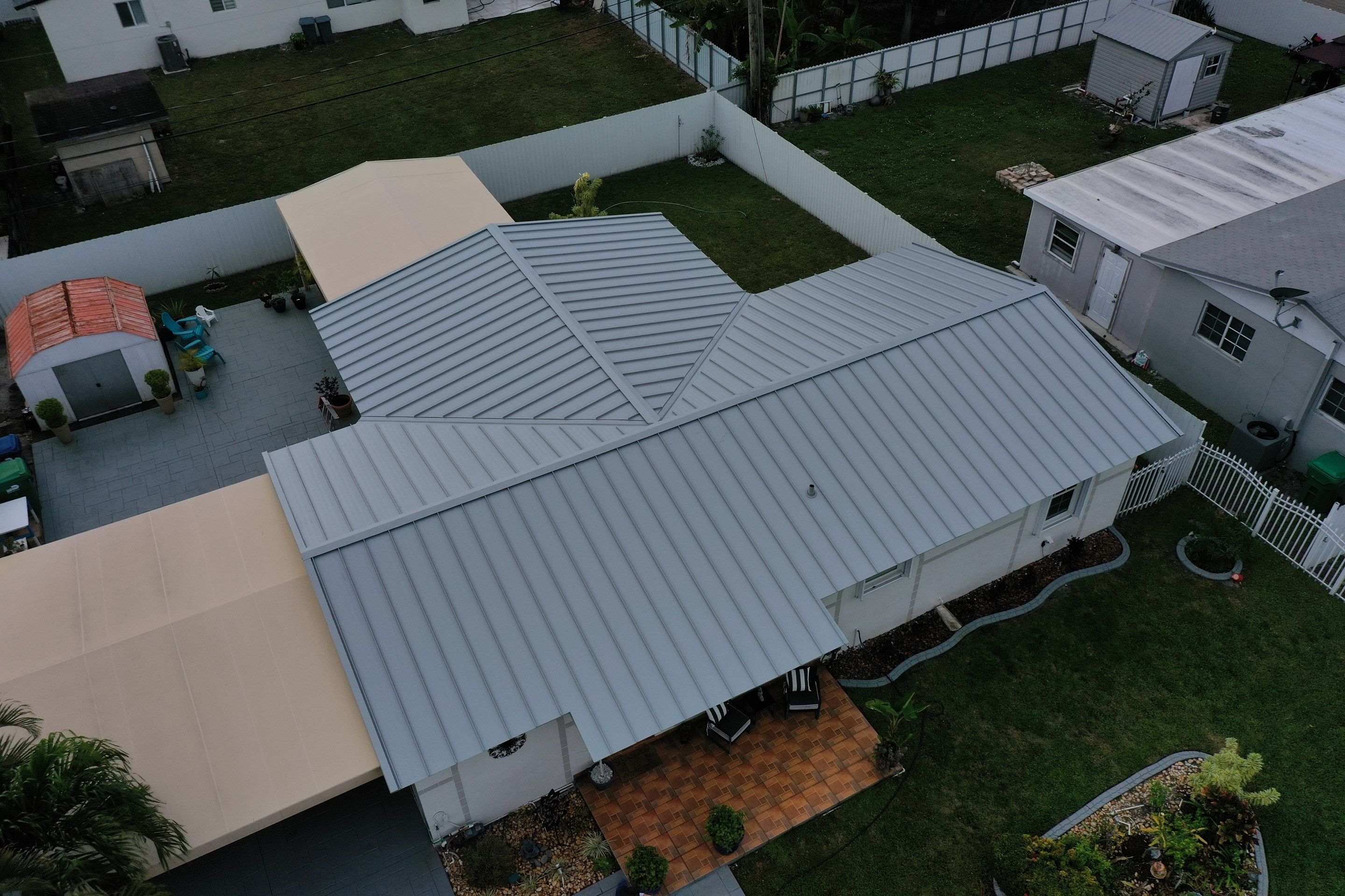 RESIDENTAL METAL REROOF 24 GUAGE DOVE GRAY 1-1/2" MECHANICAL SEAM METAL POLYGLASS POLYSTICK XFR by Earl W. Johnston Roofing 
