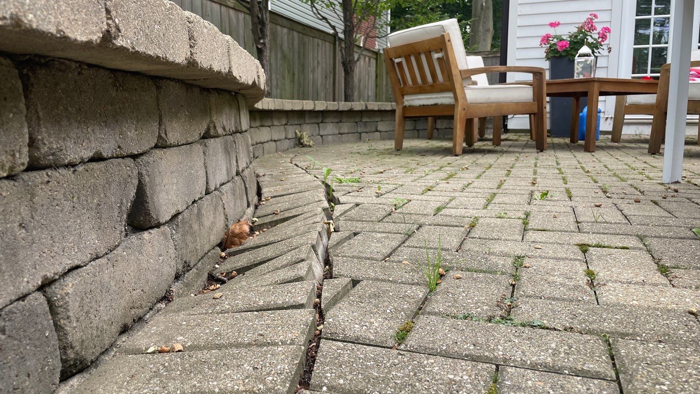 Brick patio repair, clean sand and seal by Northern Power Washing LLC.