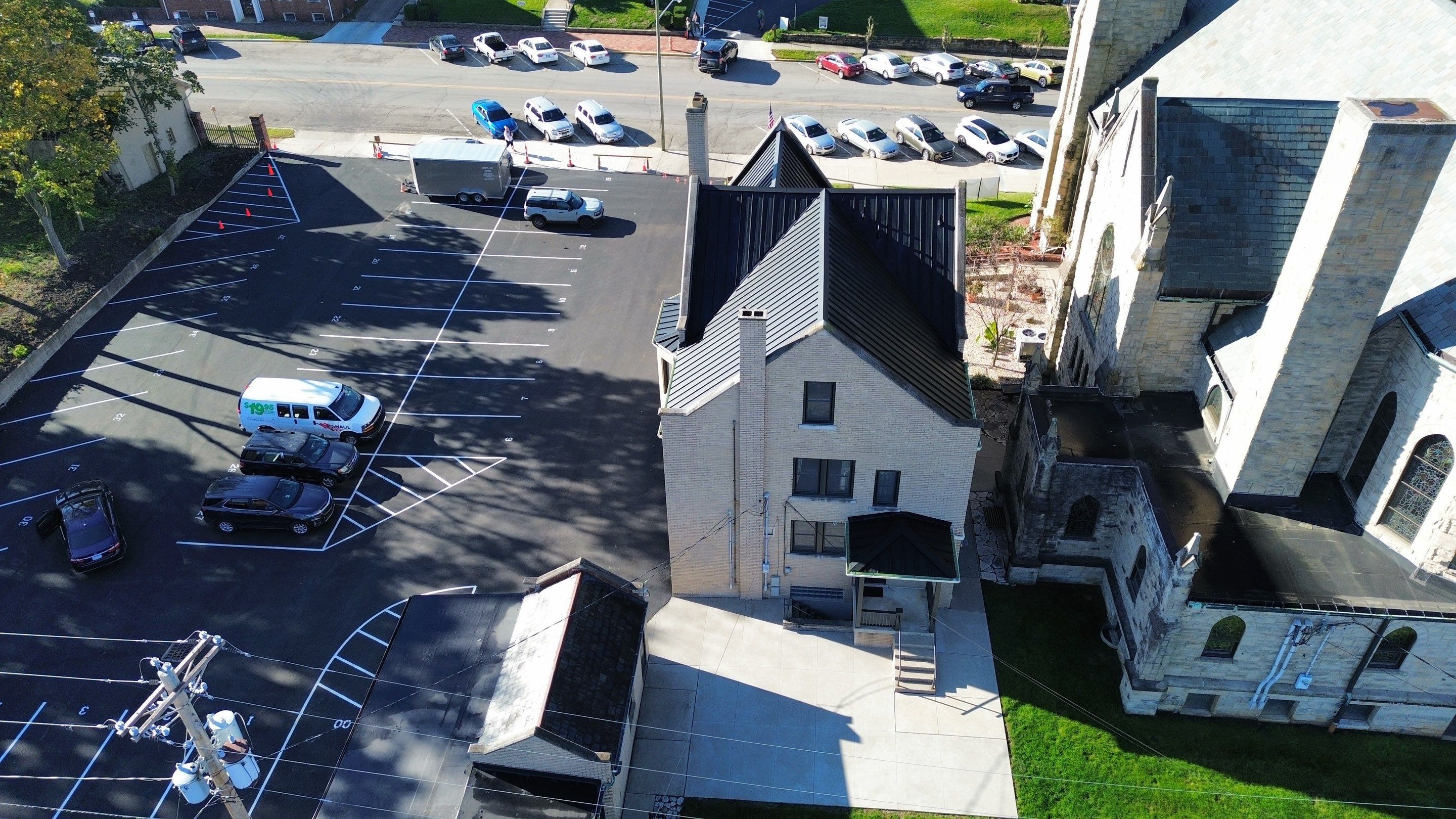 Commercial Roofing Installation using Standing Seam Metal - Frost Black by RoofX 