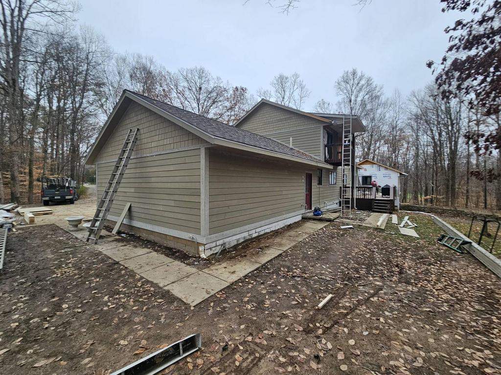 Siding Installation using Primed James Hardie & Straight Edge Shakes by Koontz Construction