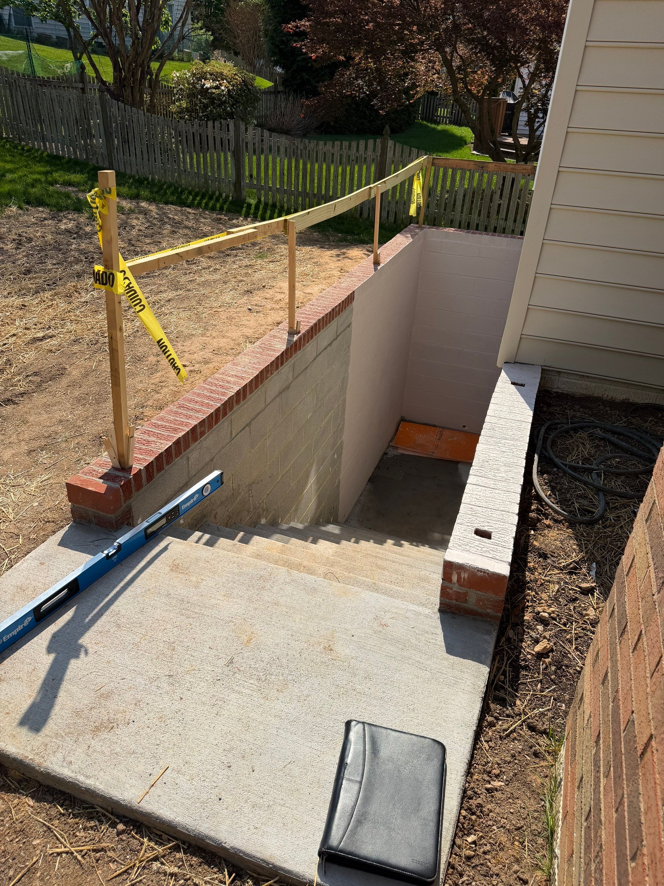 Basement Stairwell and Window Well Railing Installation in Germantown by Capitol Iron Works