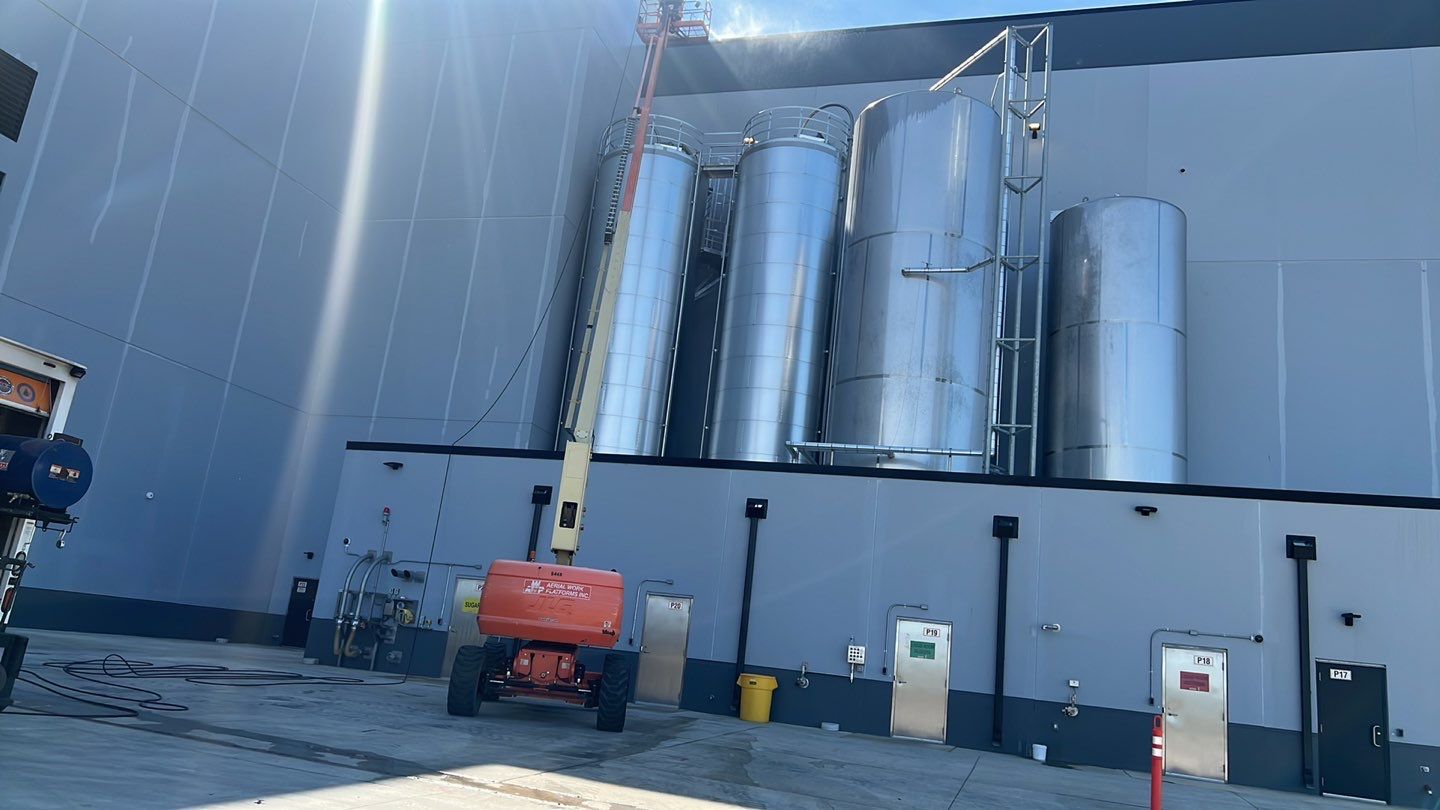 Oil removal using hot water and environmentally friendly degreaser by Northern Power Washing LLC.