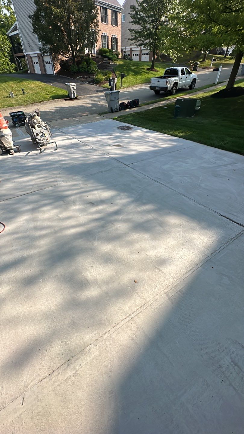 Pool Deck + Driveway + Garage Project in Venetia by Floors in a Day, Inc