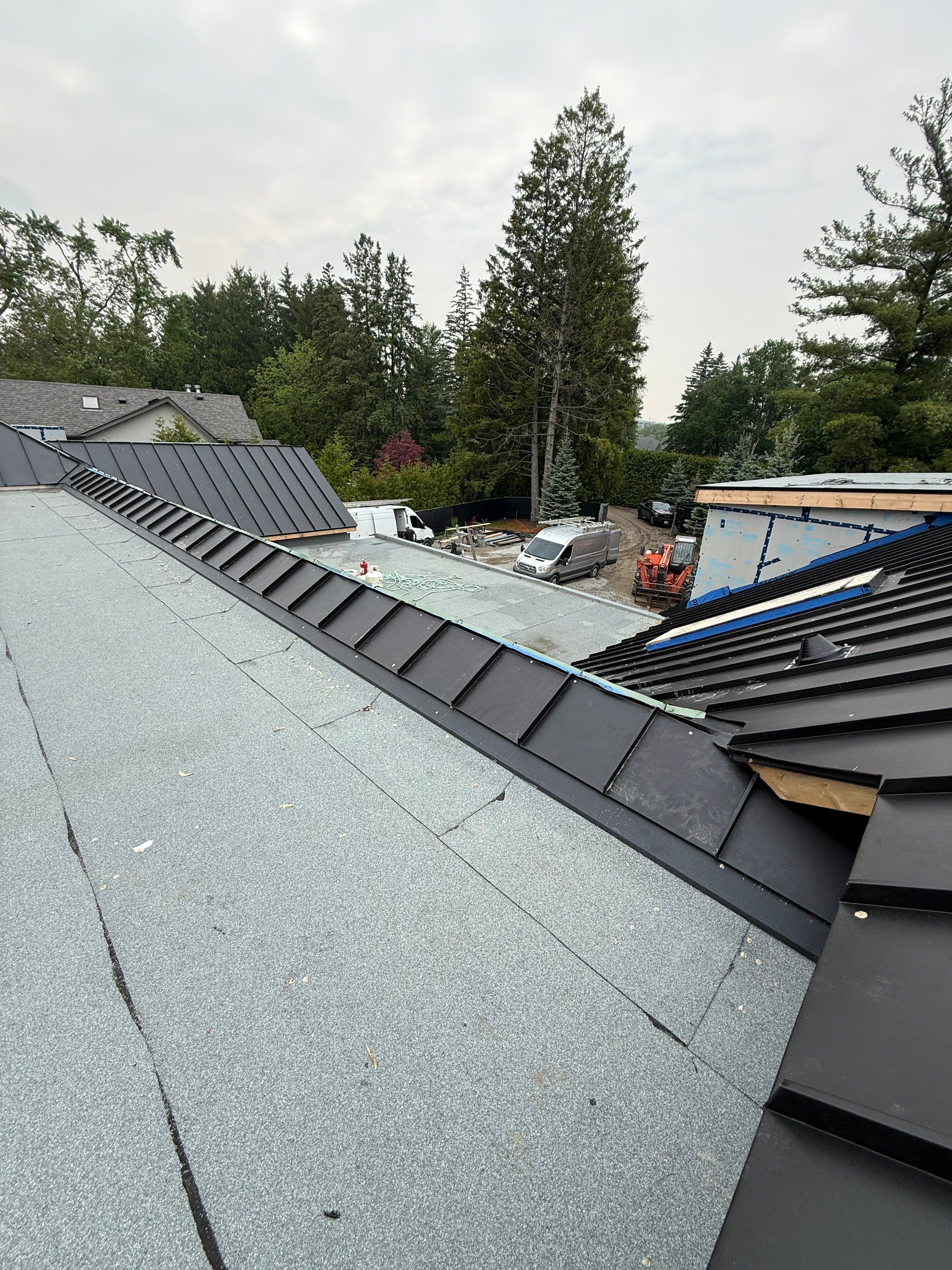 Custom Home Jet Black 24 GA Standing Seam Roof  by Jay Carter Roofing & Sheet Metal