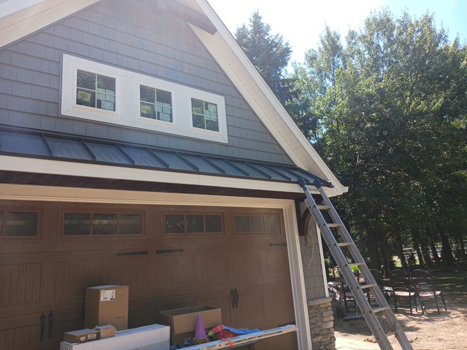 Garage Metal Roof using Standing Seam Metal by Absolute Roofing and Construction