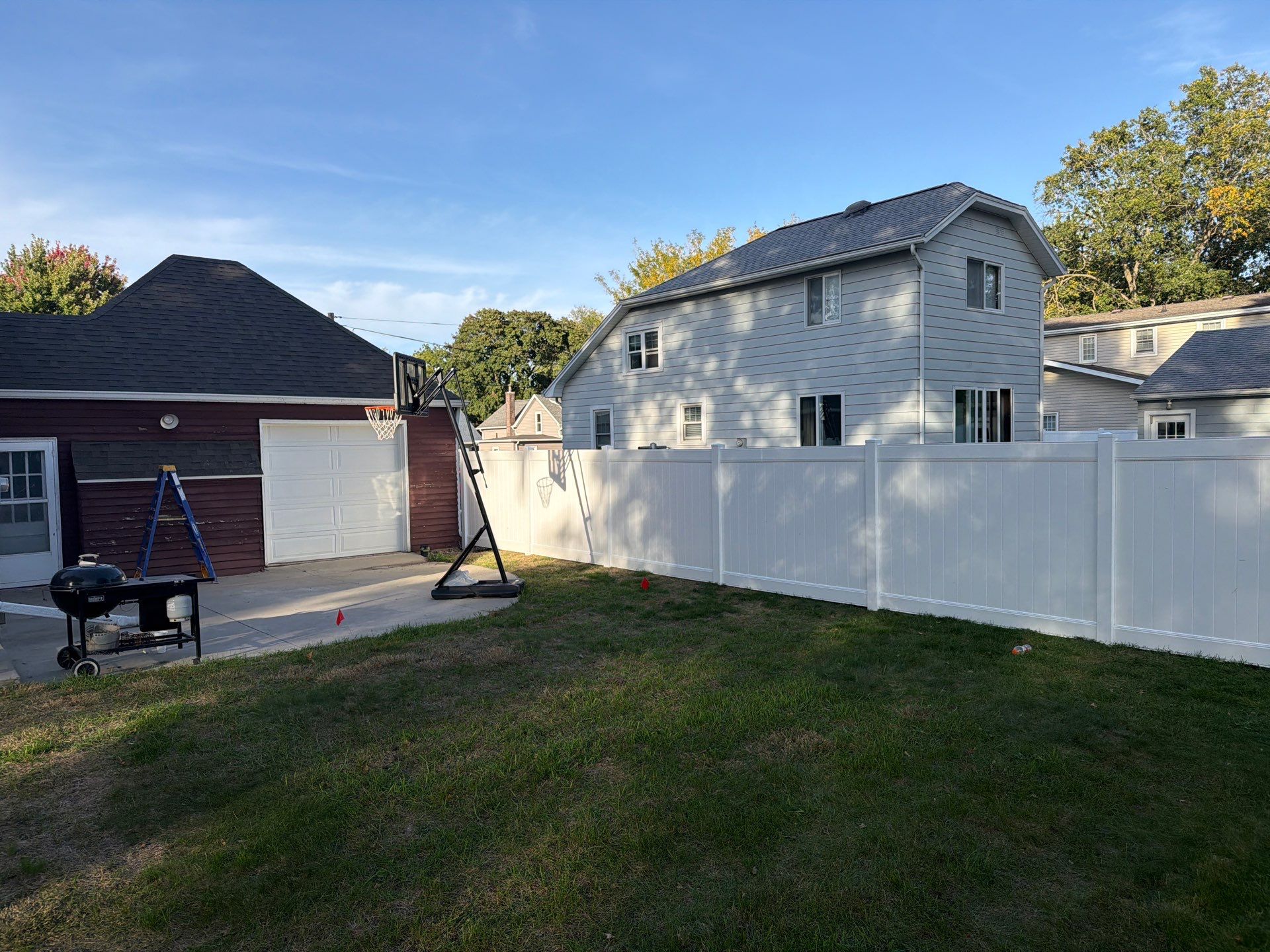 White Vinyl Privacy Fence and Gate Installation in Grundy Center by Perfect Picket Fence and Stain