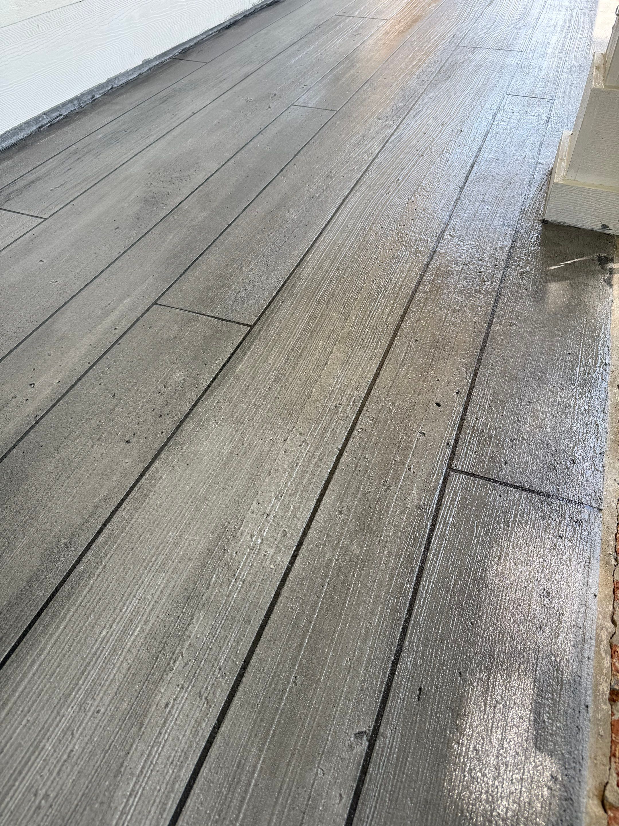 Wood-Grain Stenciled Concrete Porch Resurfacing in Mobile by Cornerstone Hard Surface Restoration 