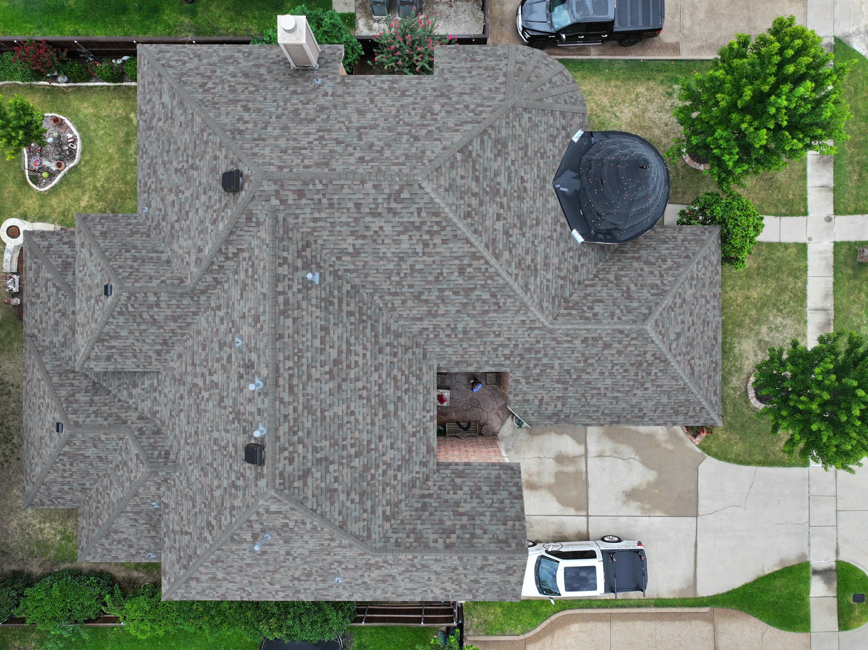 Installing Custom copper turret and Malarkey Vista Class 4 shingles Hail Damage Upgrade by Becker Roofing and Exteriors