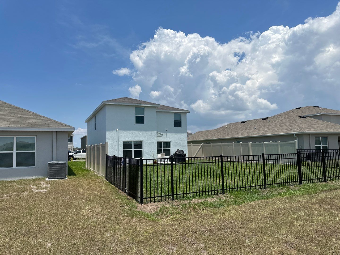 Aluminum Fence Installation using Black 3 Rail Aluminum Fence and Tan Vinyl Privacy Fence by Asap fence and gates, LLC