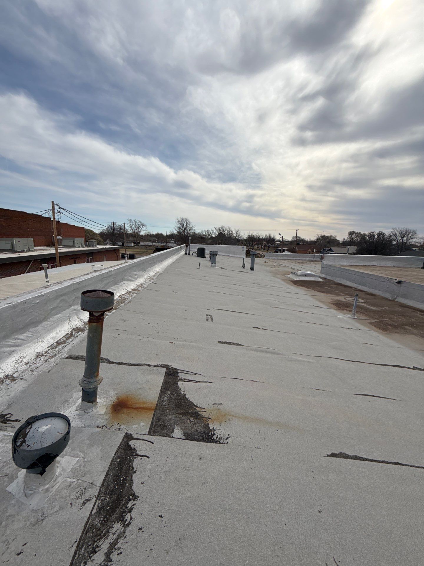 Hollis High School Comprehensive TPO Roof Replacement and Restoration by Secondary Rhodes