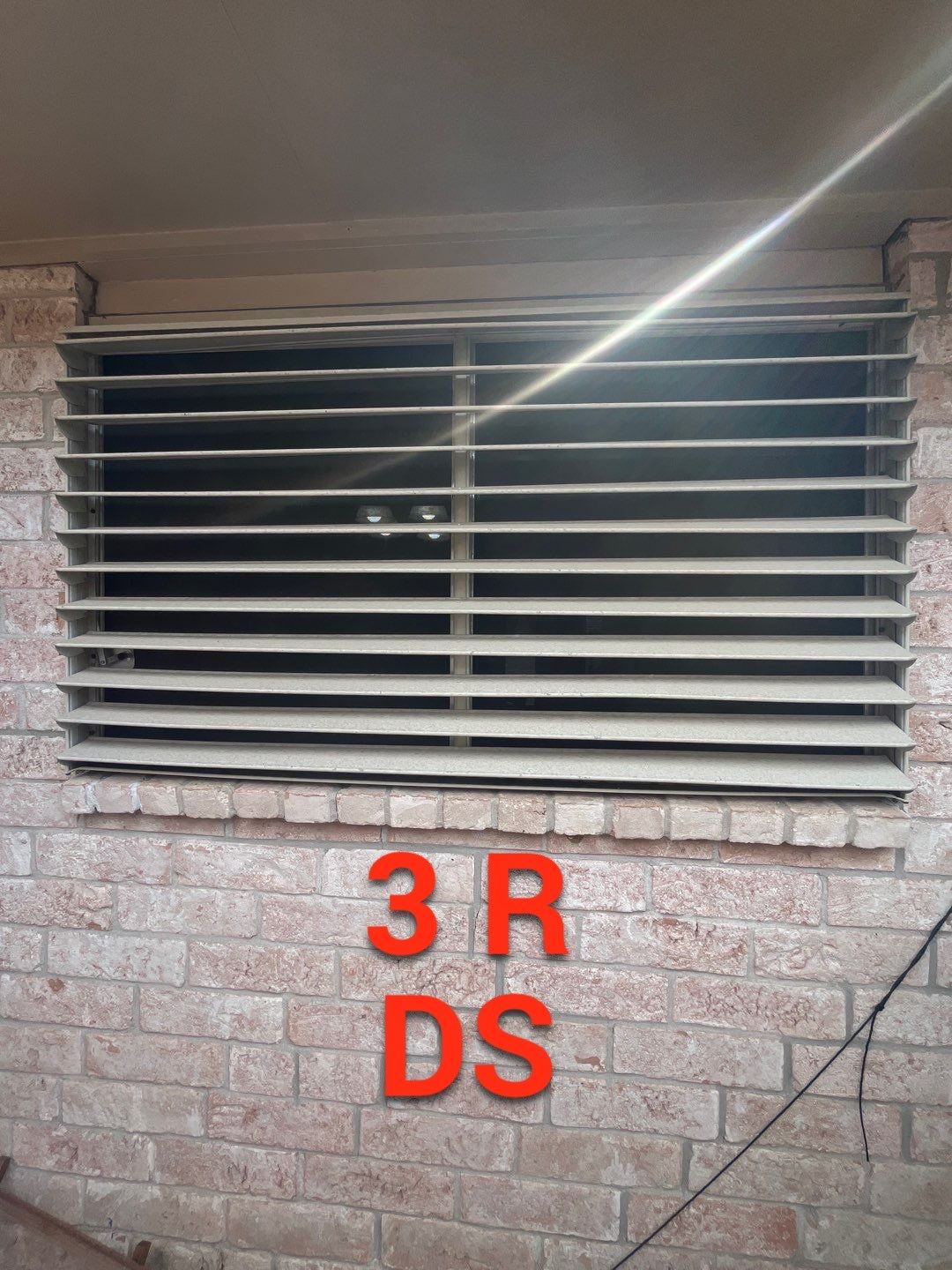 Colored Vinyl Windows to blend into brick by Bayfront Roofing and Construction