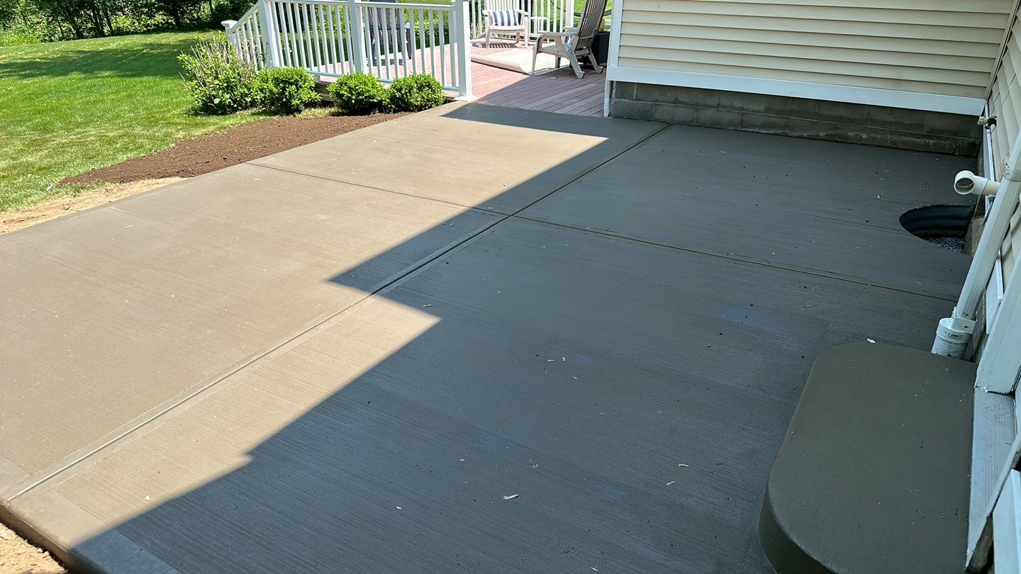 Broom finished concrete patio  by NG Masonry & Construction LLC