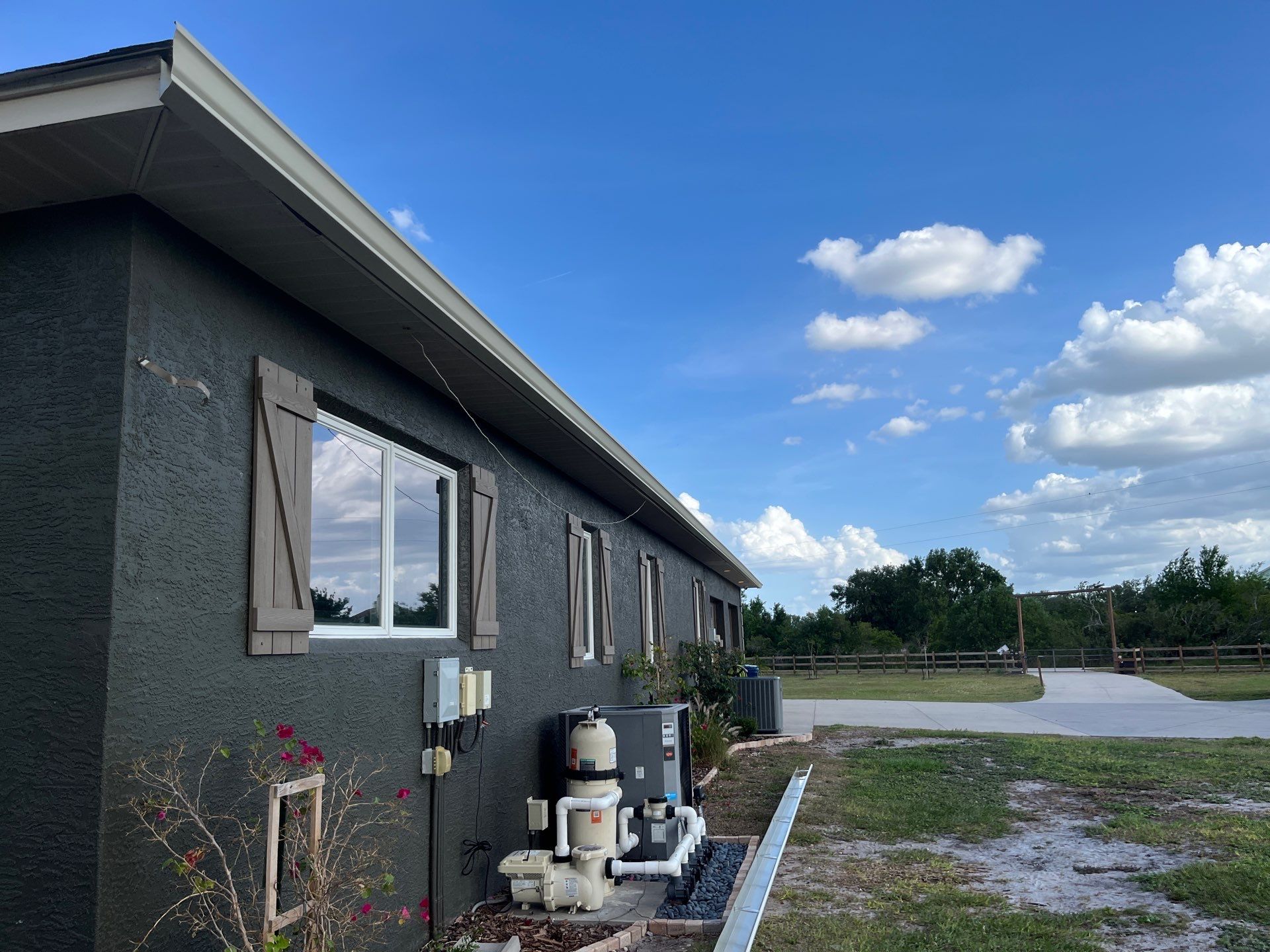  7-inch White seamless gutters and downspouts in Myakka City FL by Gutter Professors