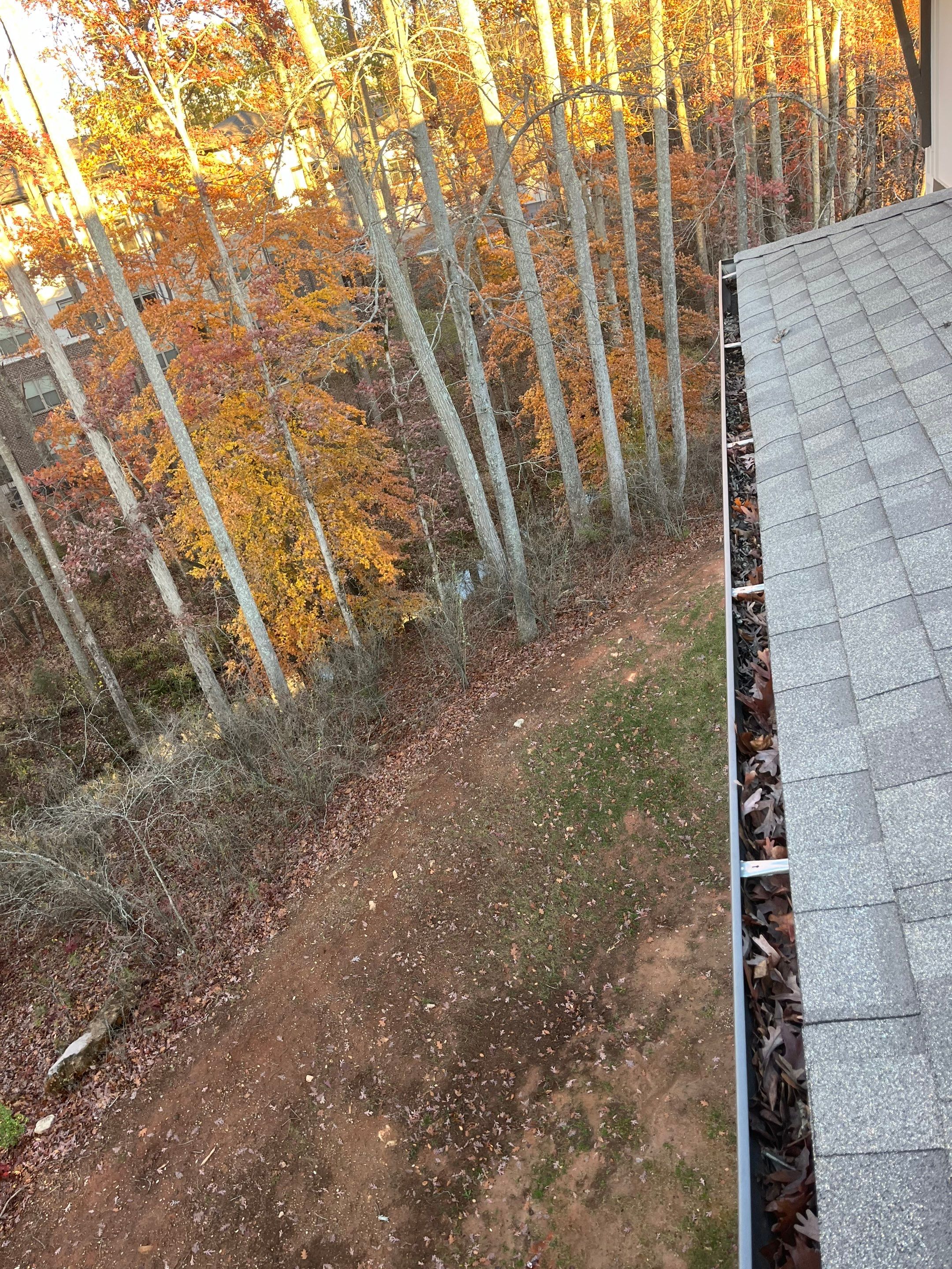 Commercial gutter cleaning Newnan & Peachtree City, GA before photo with filled gutters