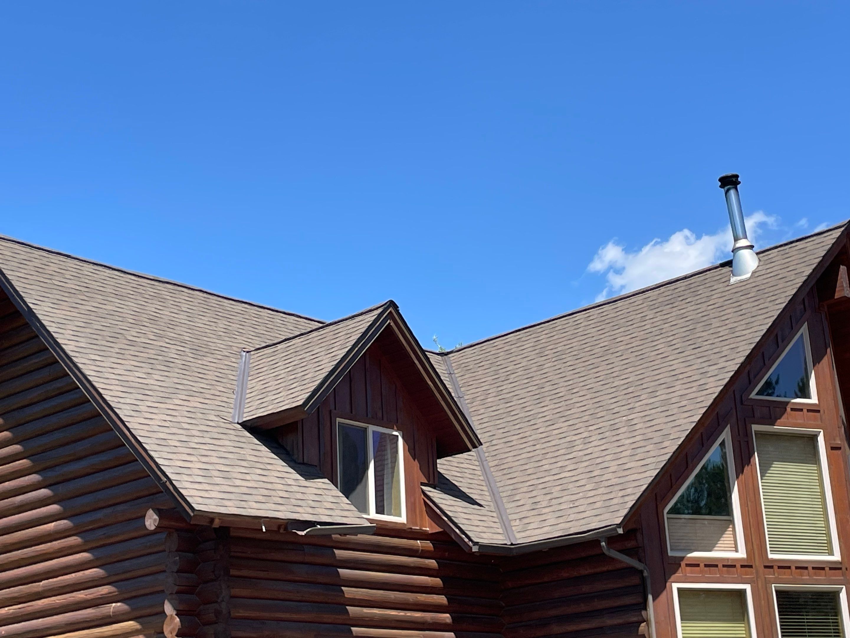 Architectural Shingle Roof Installation for Spirit Lake Log Home Coeur D'Alene Drive Spirit Lake, Idaho, 83869 (SECTION A) PARTIAL ROOF REPLACEMENT - CertainTeed 50 Year Material Guarantee - CertainTeed Workmanship Guarantee: 30 Years - CertainTeed Warranty Transfer Period: 20 Years - Certainteed Landmark® Shingle - Heather Blend by Alpine Roofing