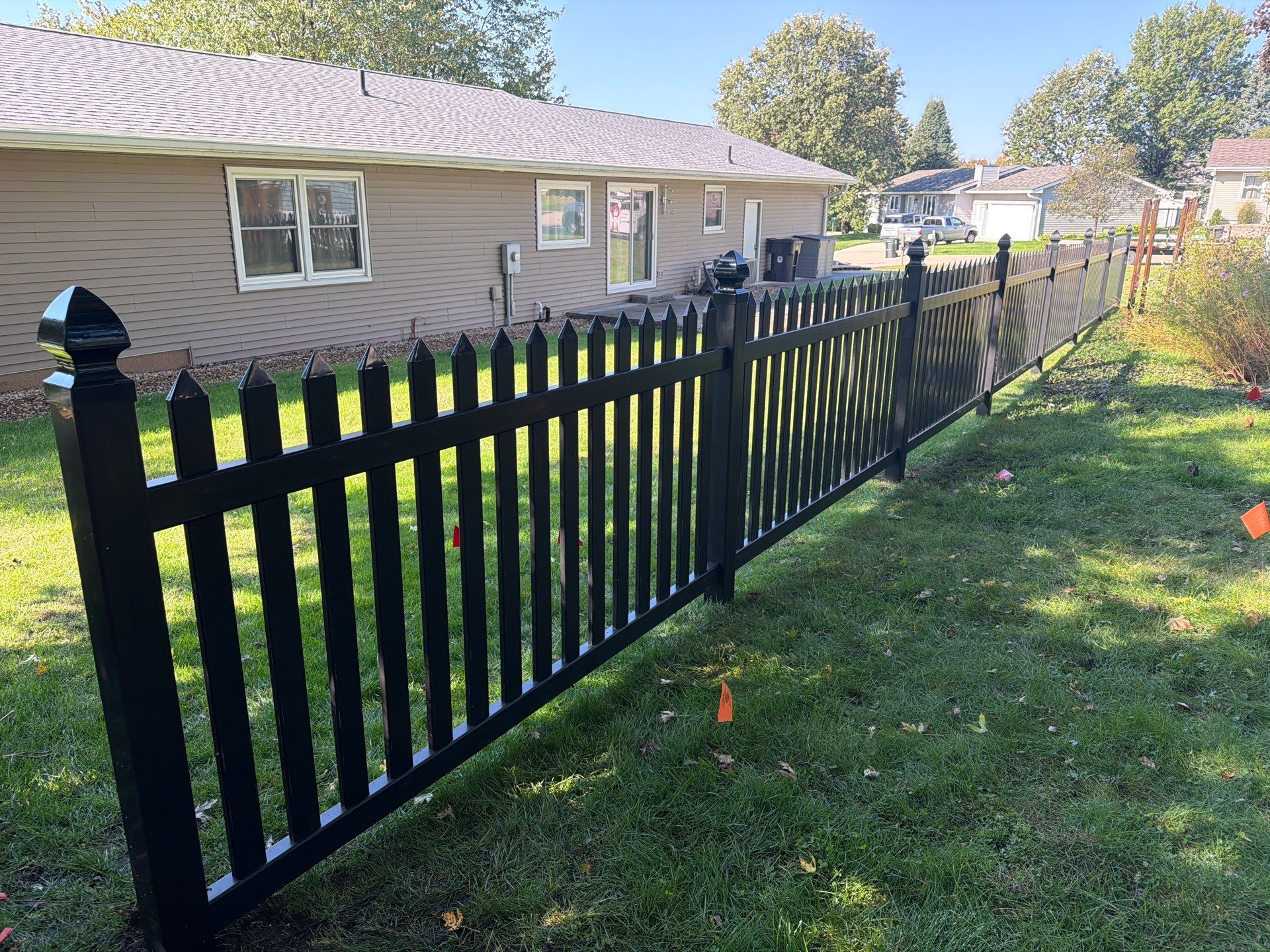 Black Vinyl Spaced Picket Fence Installation in Cedar Falls by Perfect Picket Fence and Stain