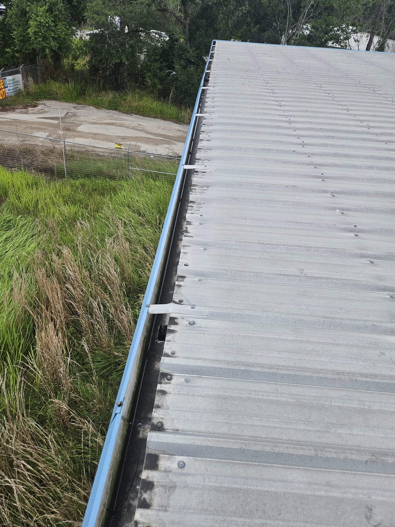 Clean Gutters and Seal Seams in Lakeland FL by Gutter Professors
