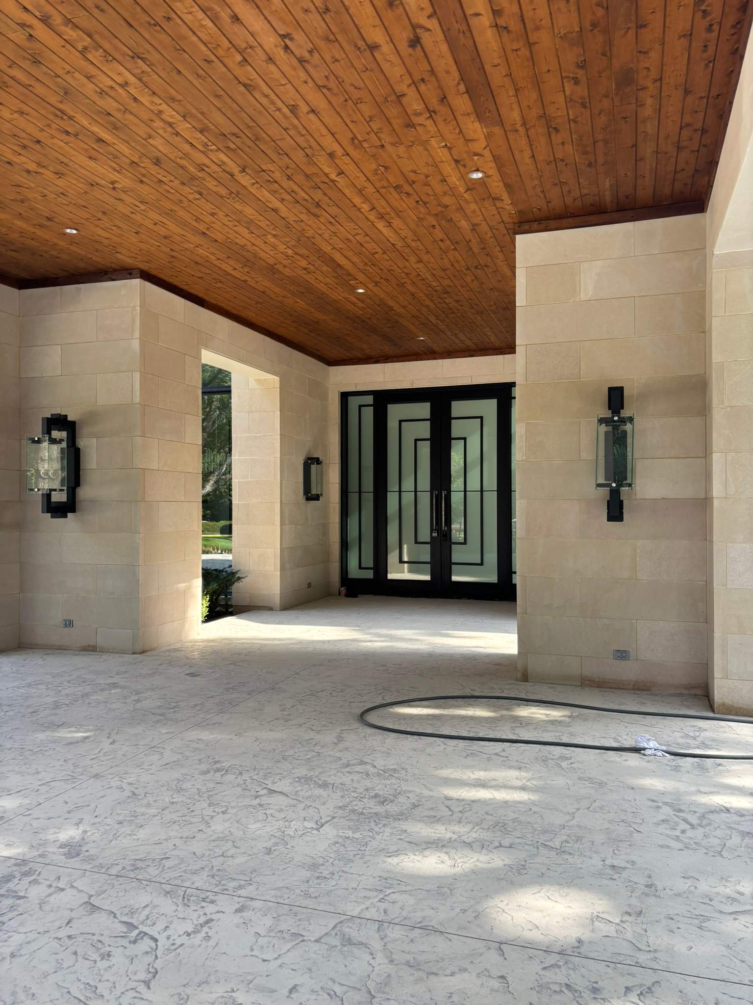 Modern Metal and Glass Entryway Installation with Custom Hardware Finishing in Dallas by Solara Custom Living