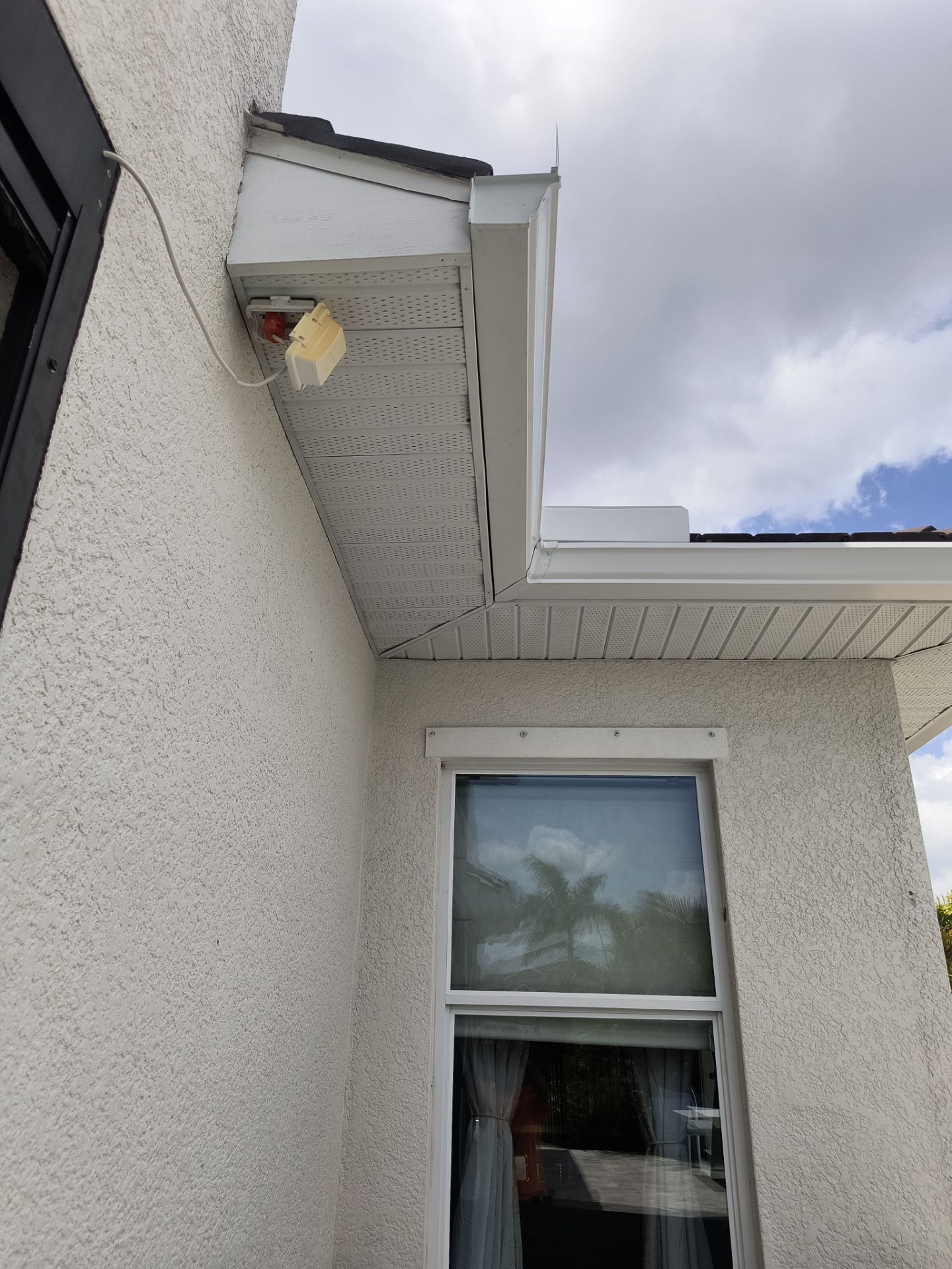 White Seamless Gutters with Downspouts in Bradenton FL by Gutter Professors