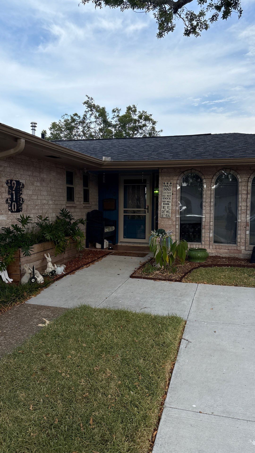 Colored Vinyl Windows to blend into brick by Bayfront Roofing and Construction